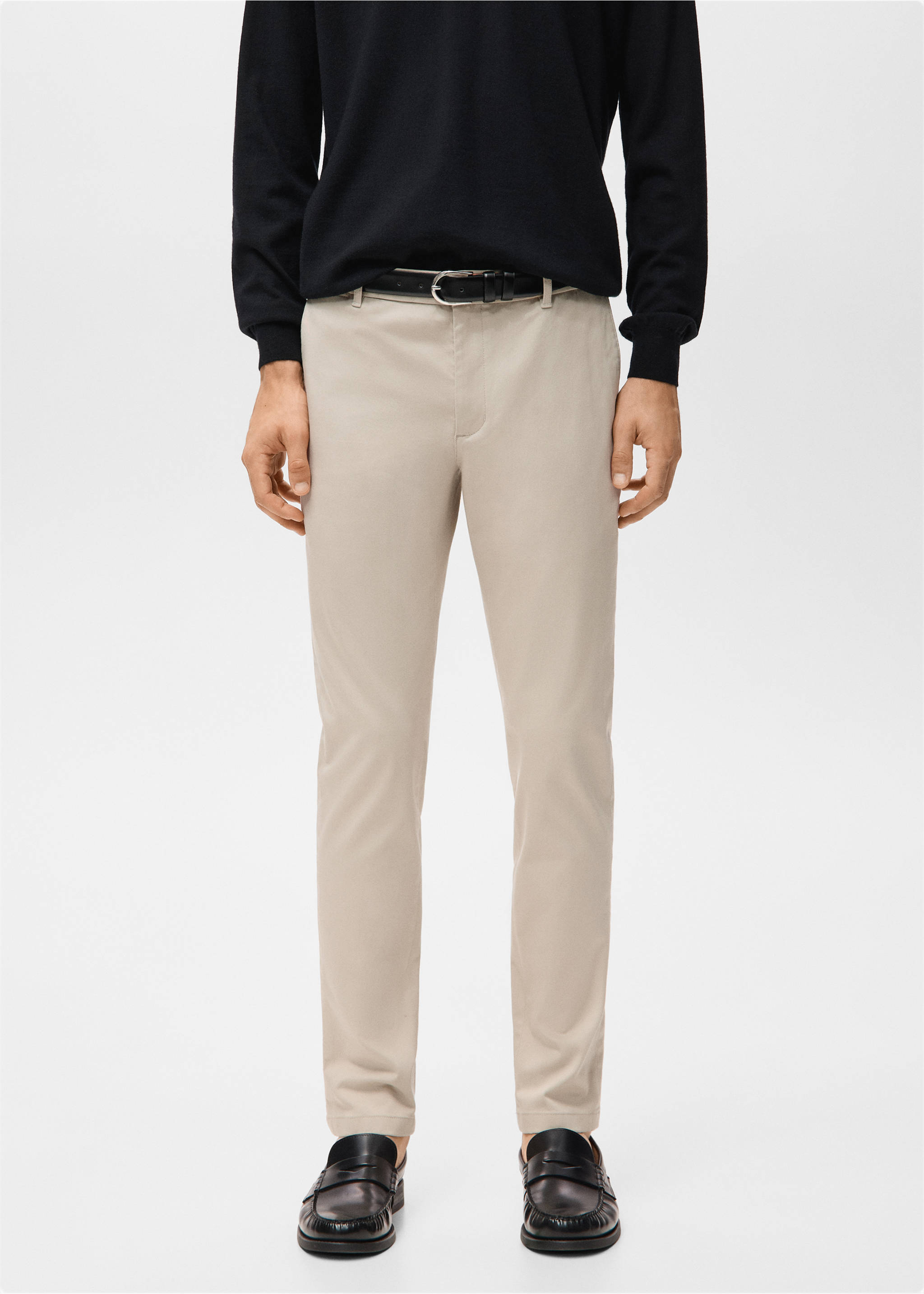 Beige slim-fit trousers worn with a black sweater and belt., Sand. Ref: 27041187-00.
