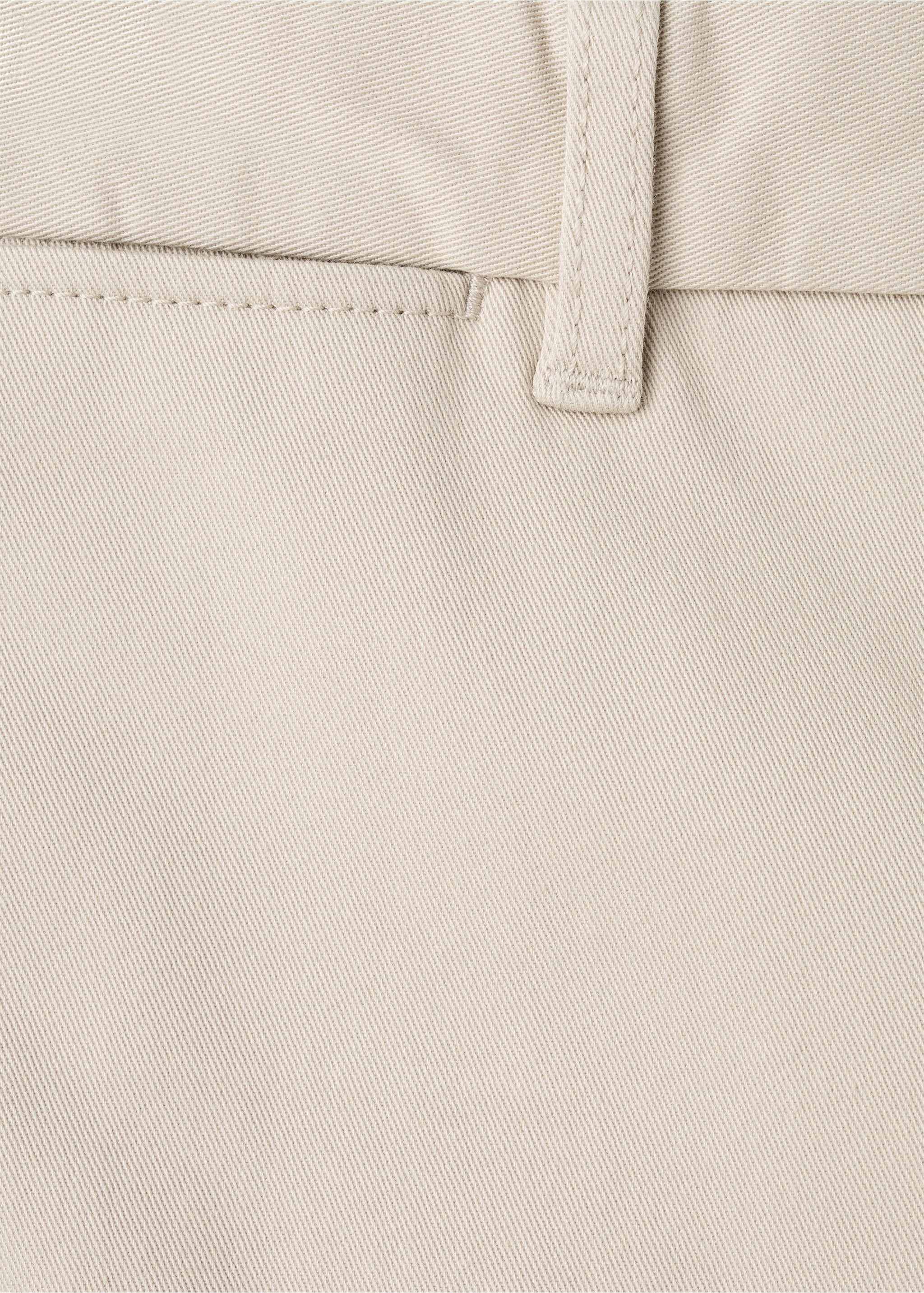 Close-up of beige men's trousers showing fabric texture and belt loop detail., Sand. Ref: 27041187-00.