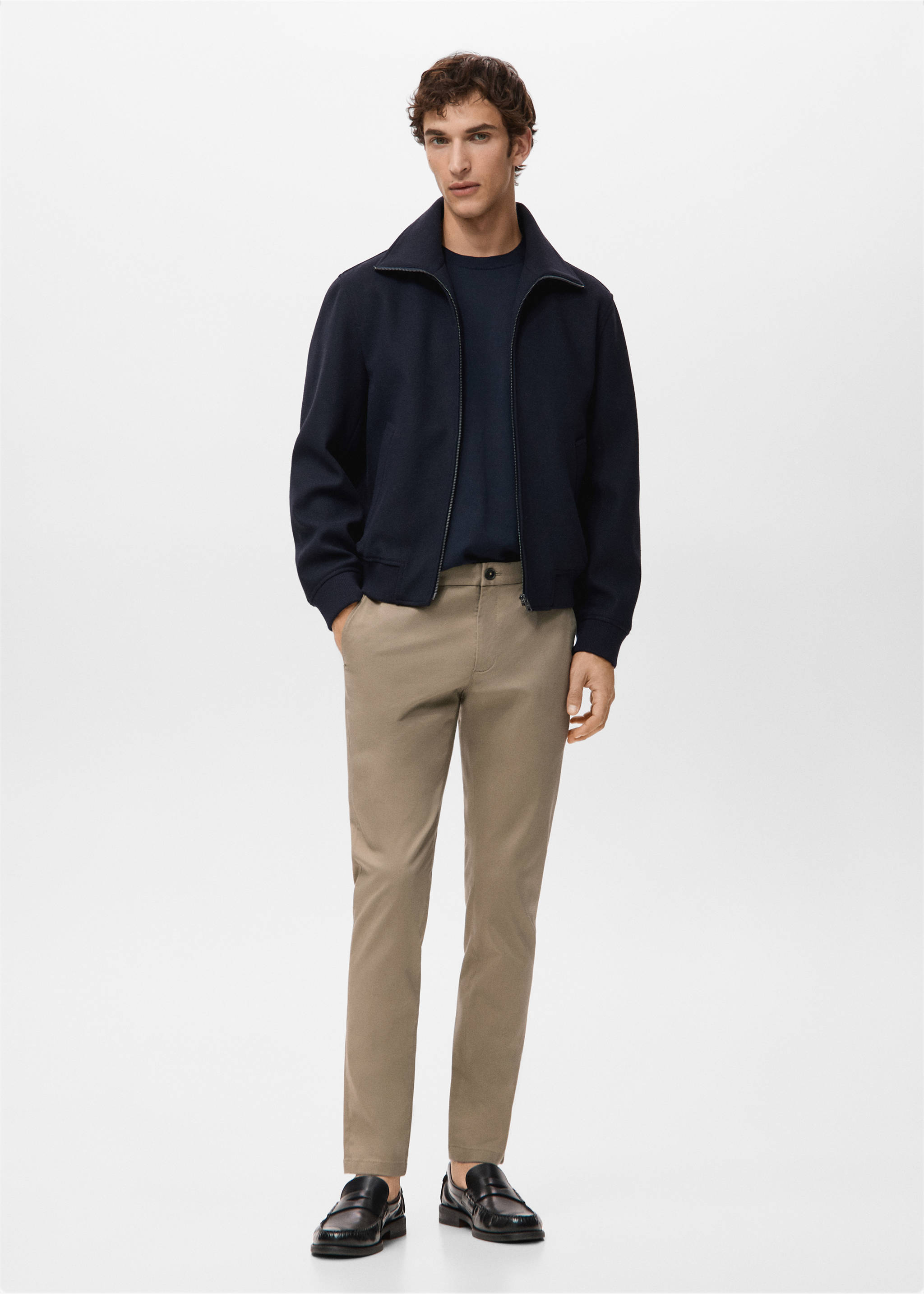 Beige trousers styled with a dark blue jacket and loafers., Beige. Ref: 27041187-00.