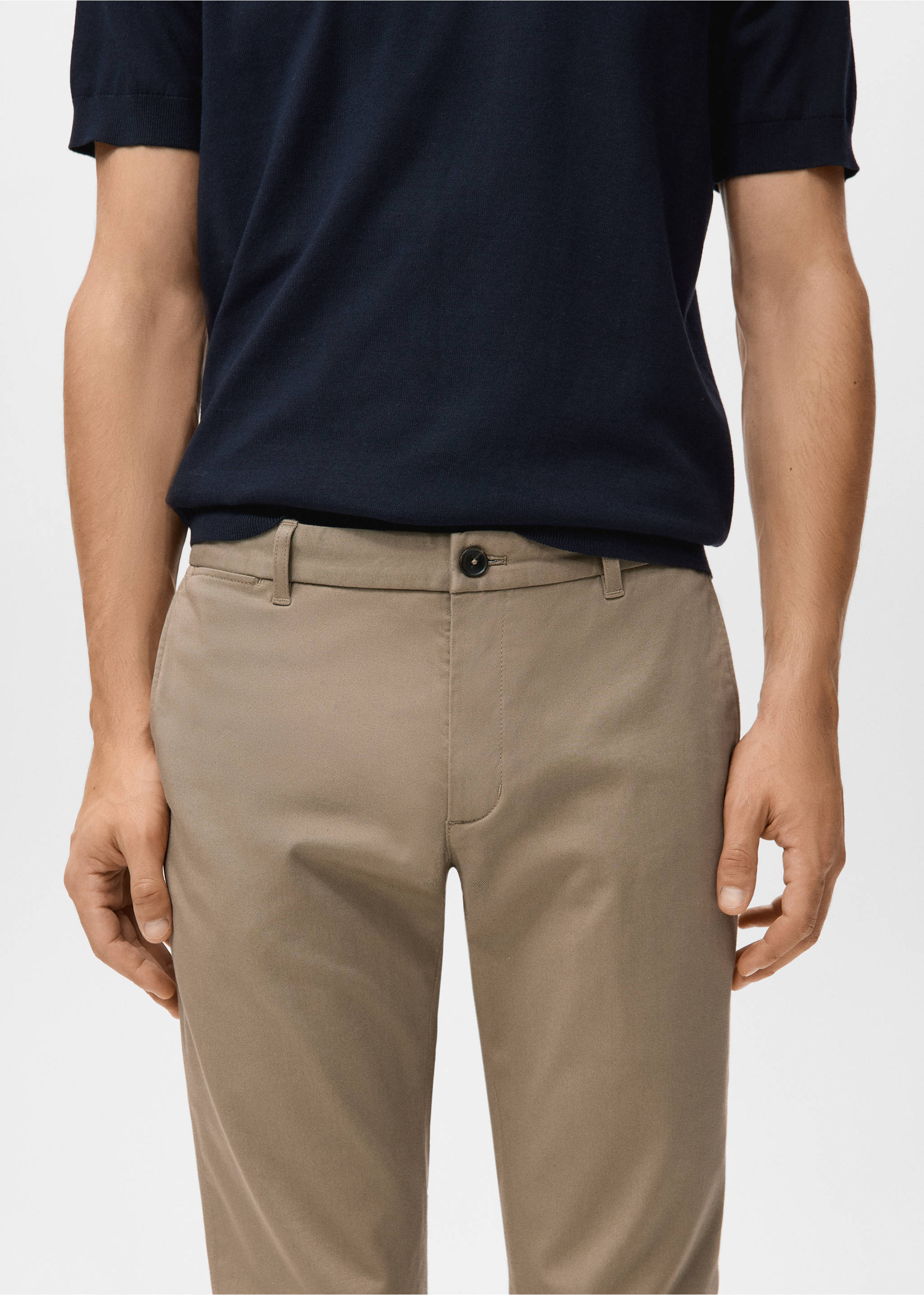 Taupe trousers with belt loops and button closure, worn with a navy blue knit top., Beige. Ref: 27041187-00.