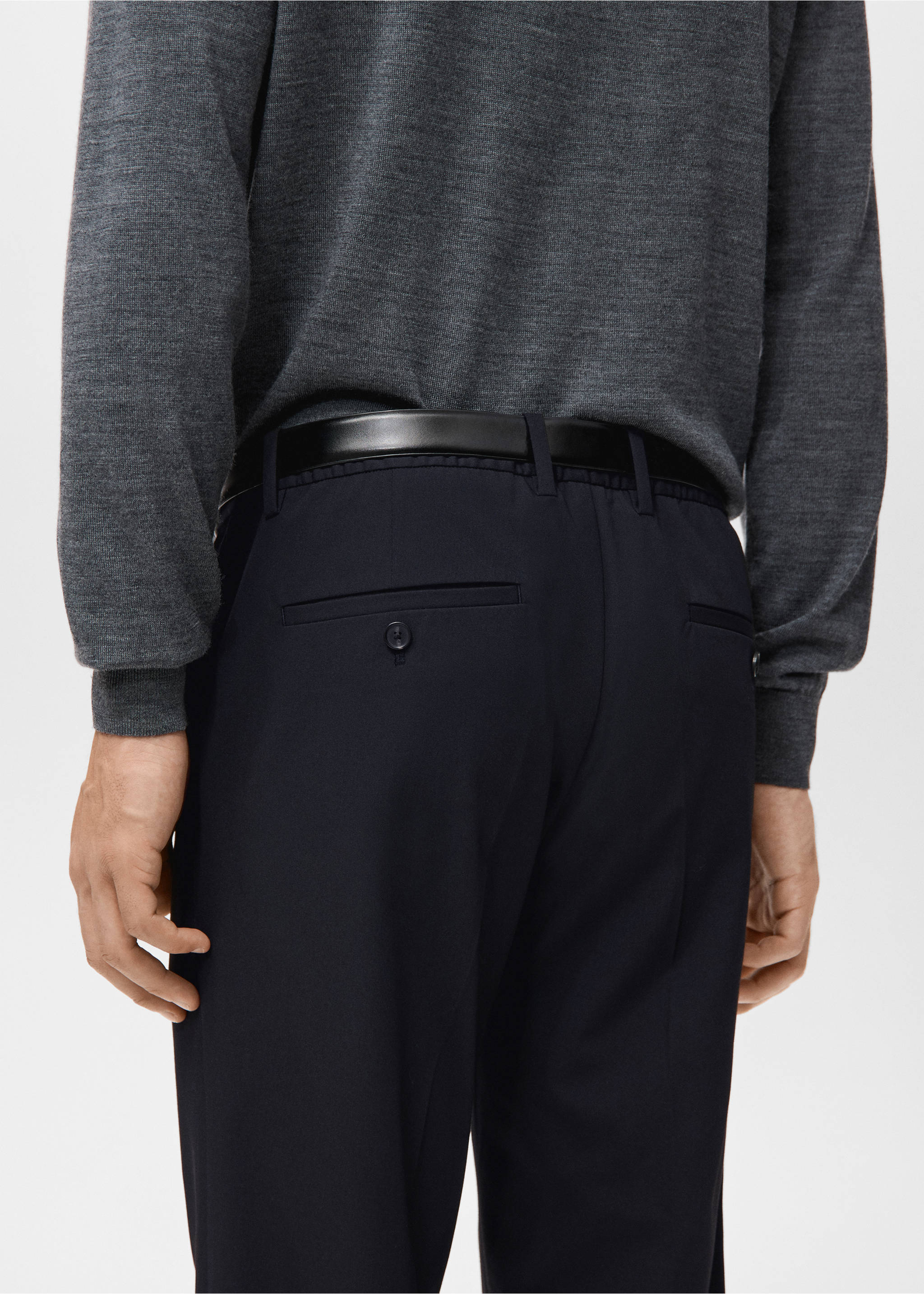 Navy blue trousers from behind, paired with a black belt and grey sweater., Navy. Ref: 27041187-00.
