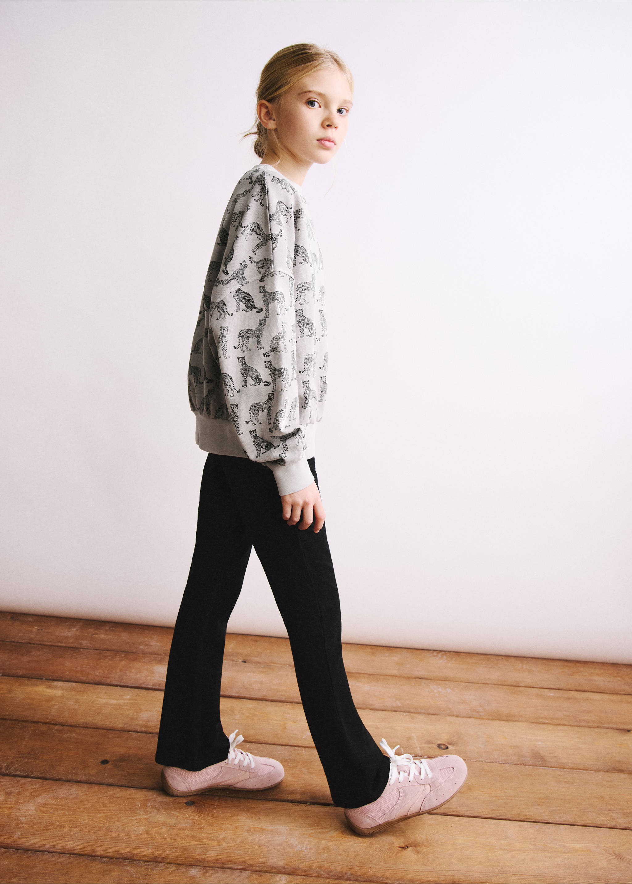 Black leggings styled with a patterned grey sweatshirt and pink trainers., Black. Ref: 27041265-00.