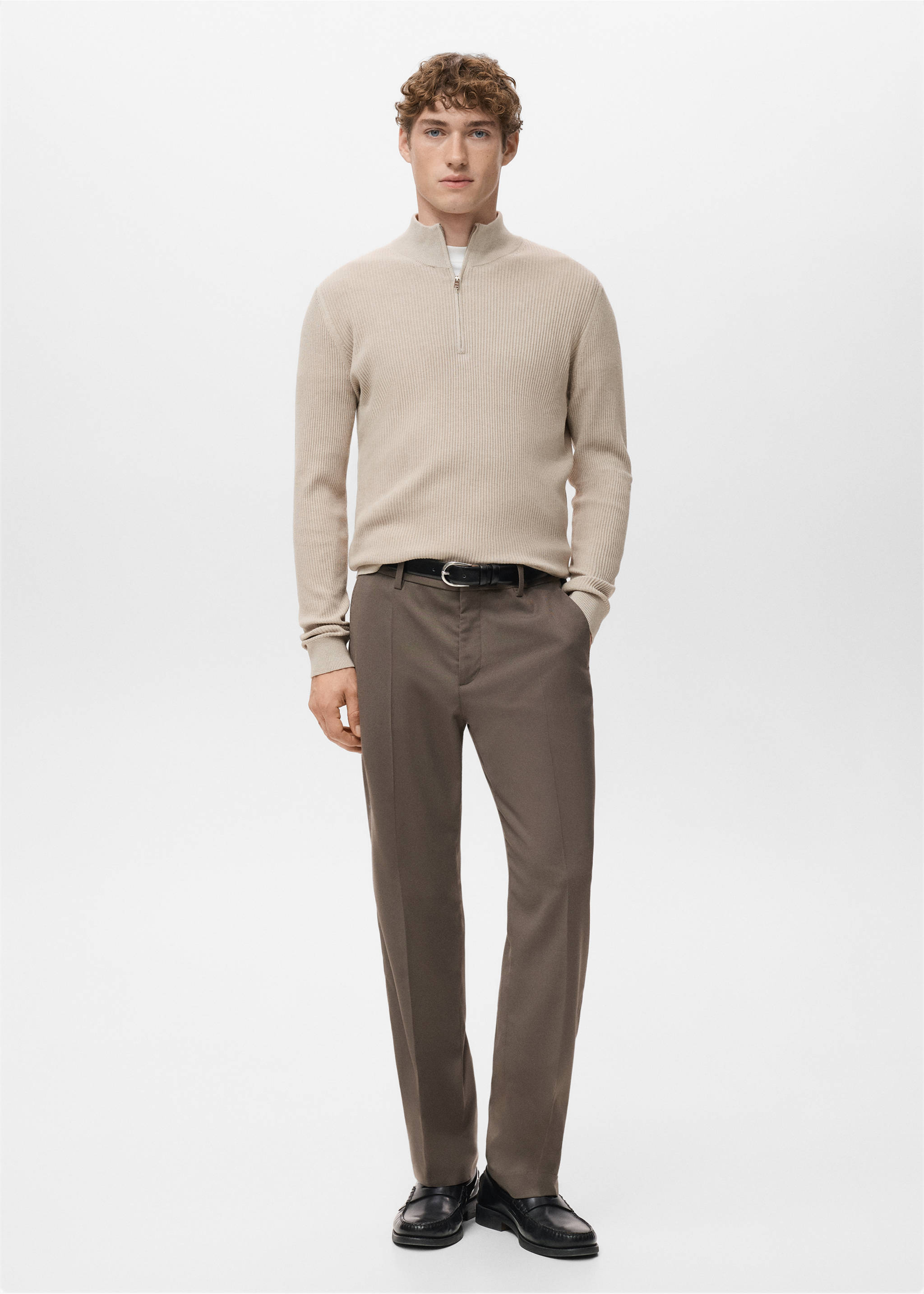 Beige ribbed knit jersey with a high zip collar worn with brown trousers., Beige. Ref: 27041283-00.