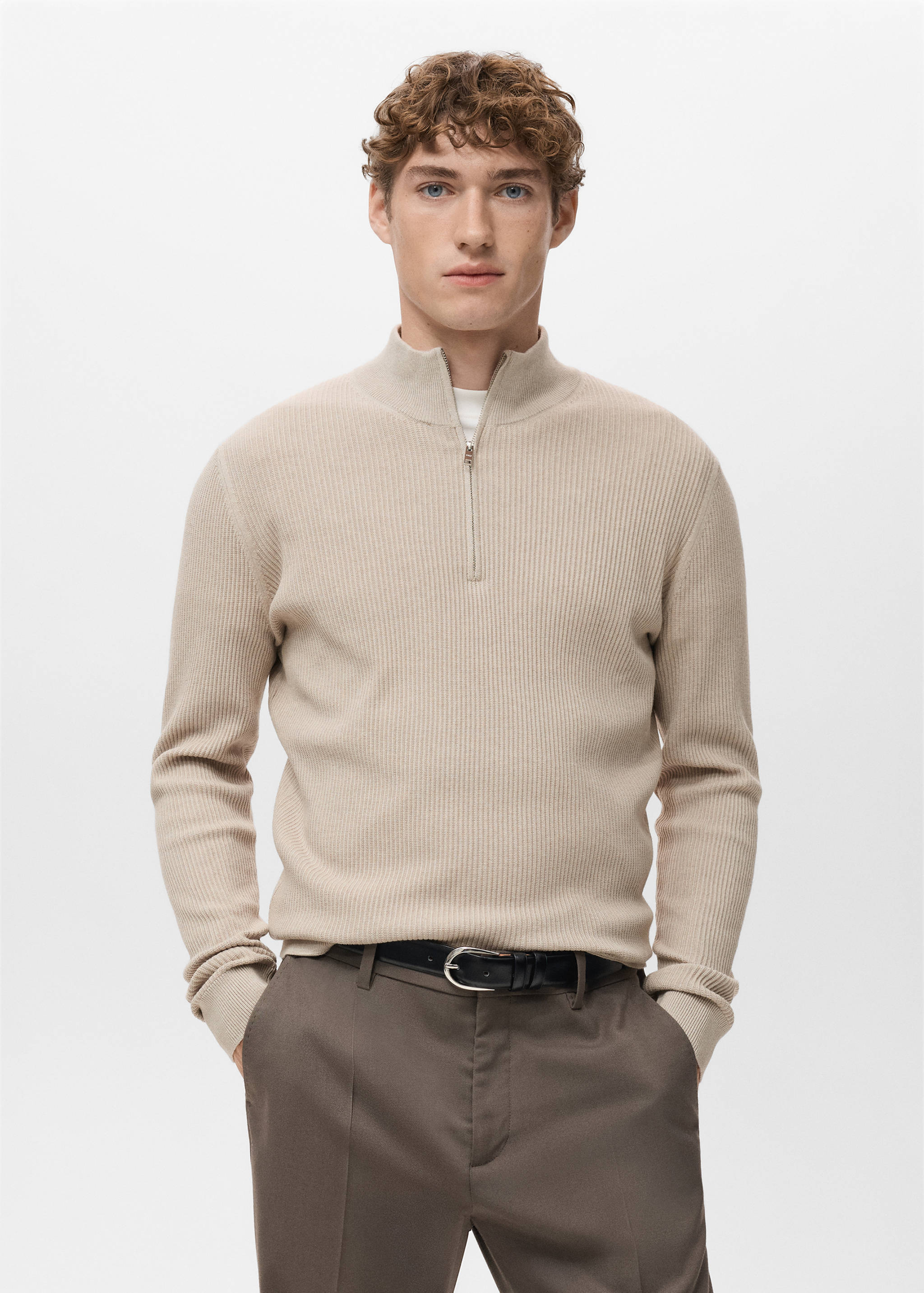 Beige ribbed knit jersey with a zip-up high neck.