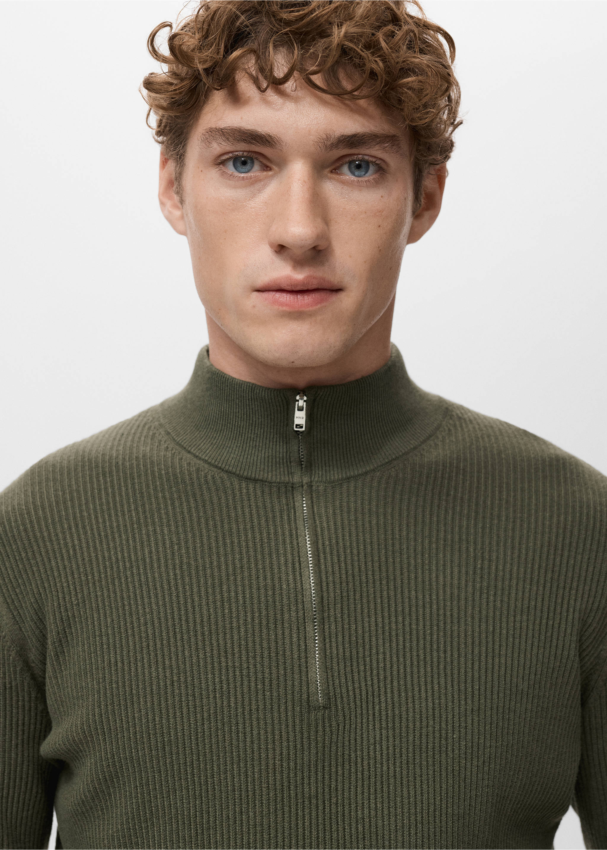 Close-up of a khaki green ribbed knit jumper with a high zip neck., Olive Green. Ref: 27041283-00.