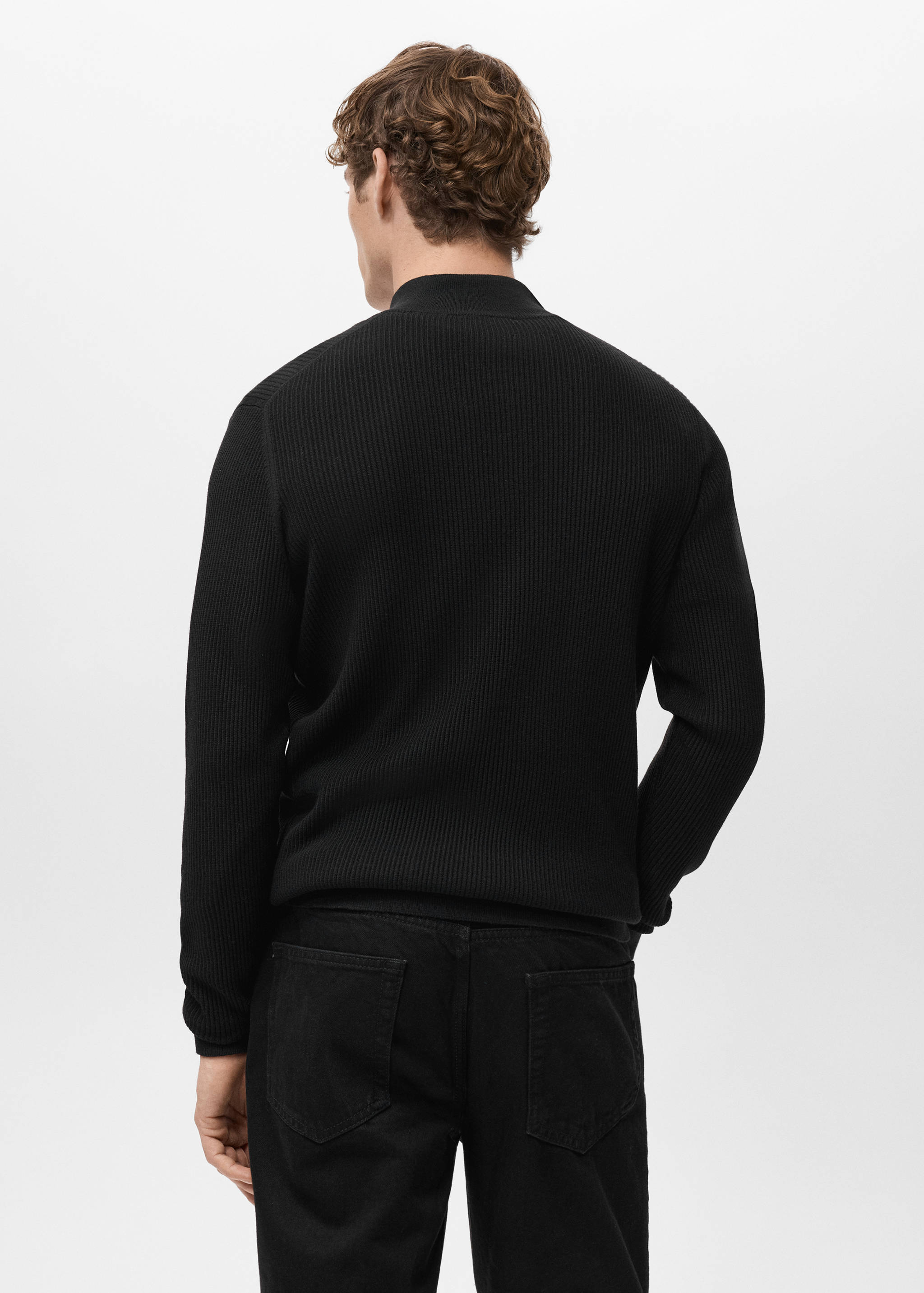Black knitted jersey with a high collar, back view