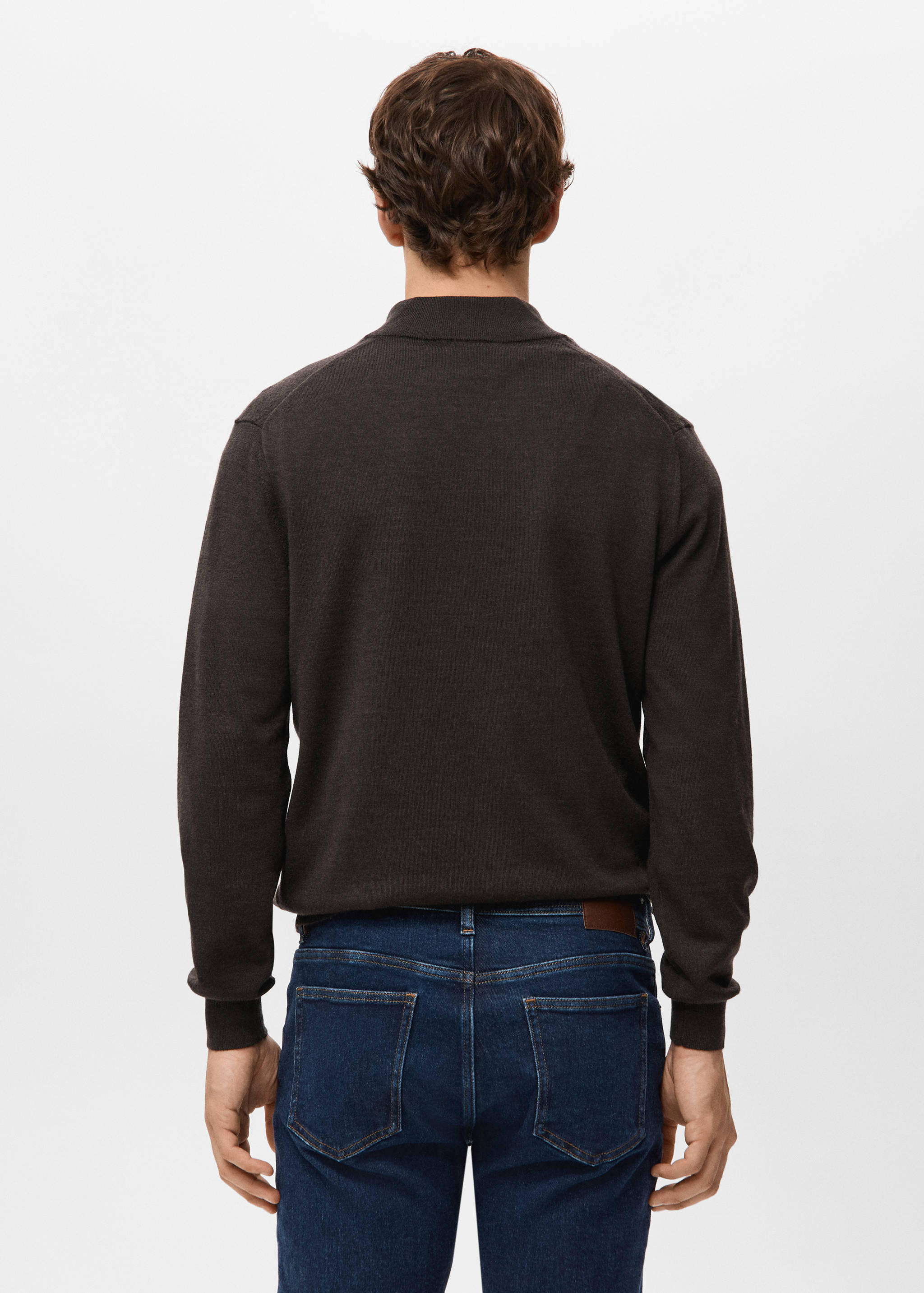 Dark brown knitted jumper shown from the back, featuring a high collar and ribbed trims.