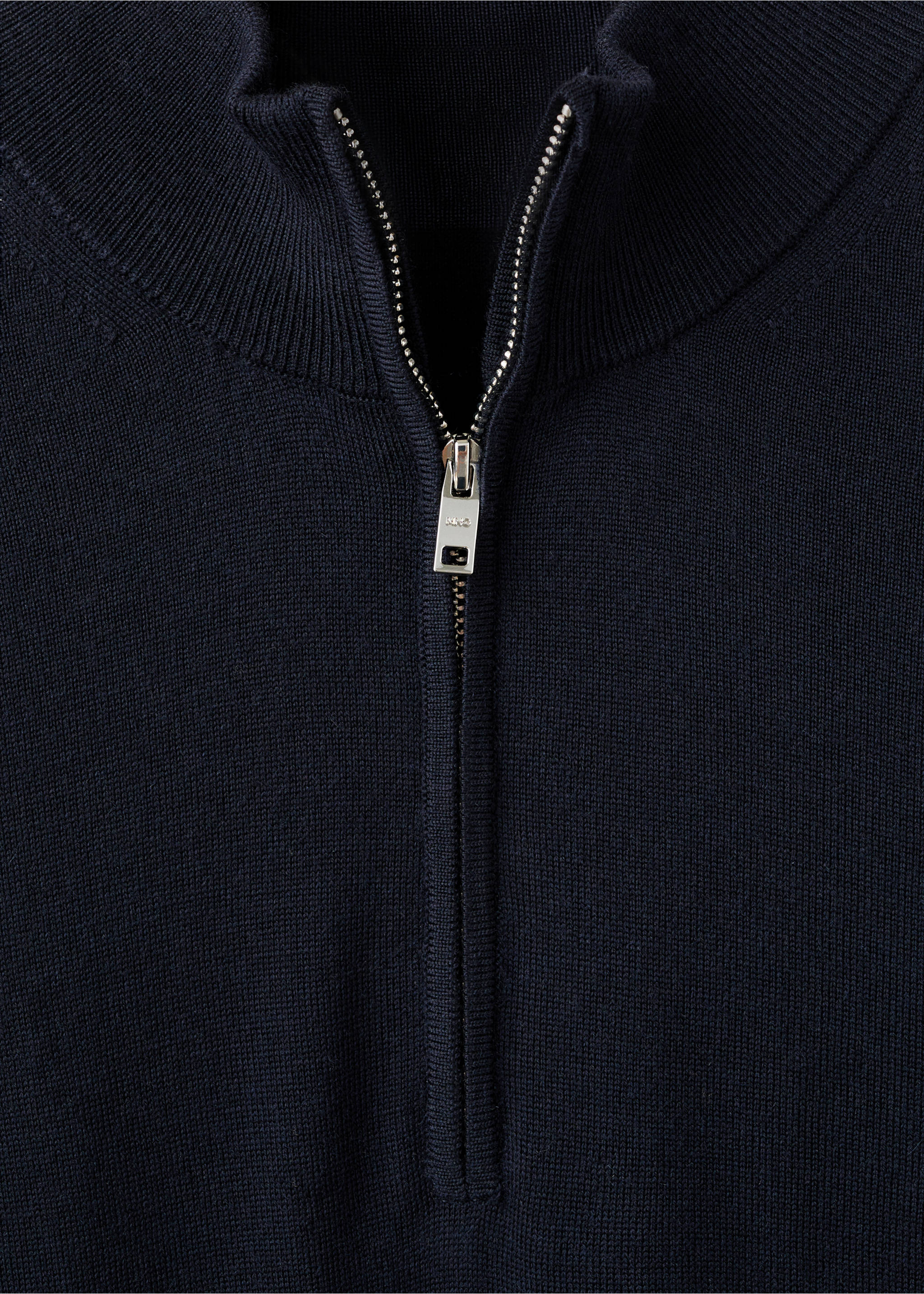 Close-up of the half-zip neck and silver zipper on a dark navy blue jersey., Navy. Ref: 27041285-00.