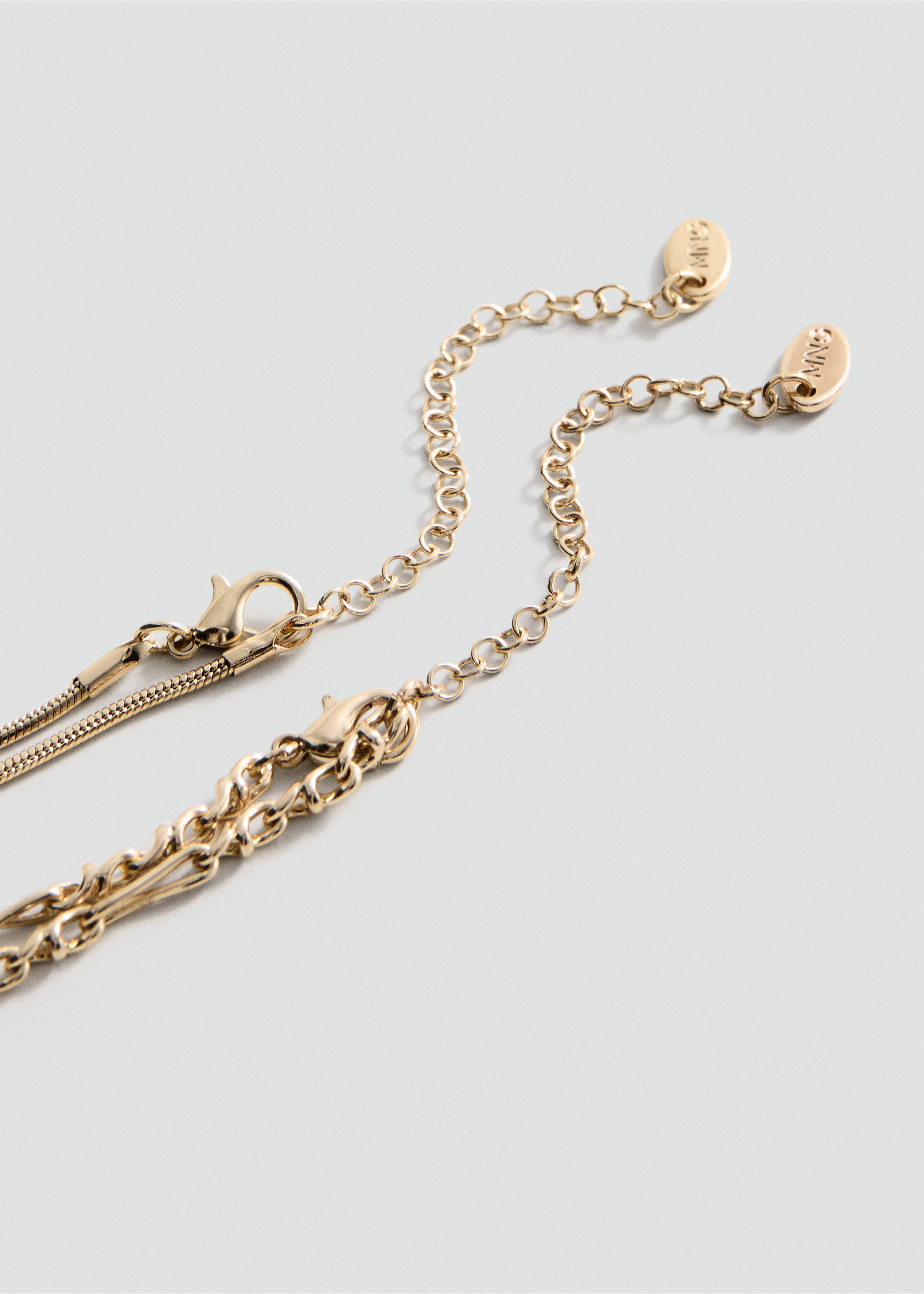 Close-up of a gold-toned necklace with adjustable chain and lobster clasp., Gold. Ref: 27041292-00.