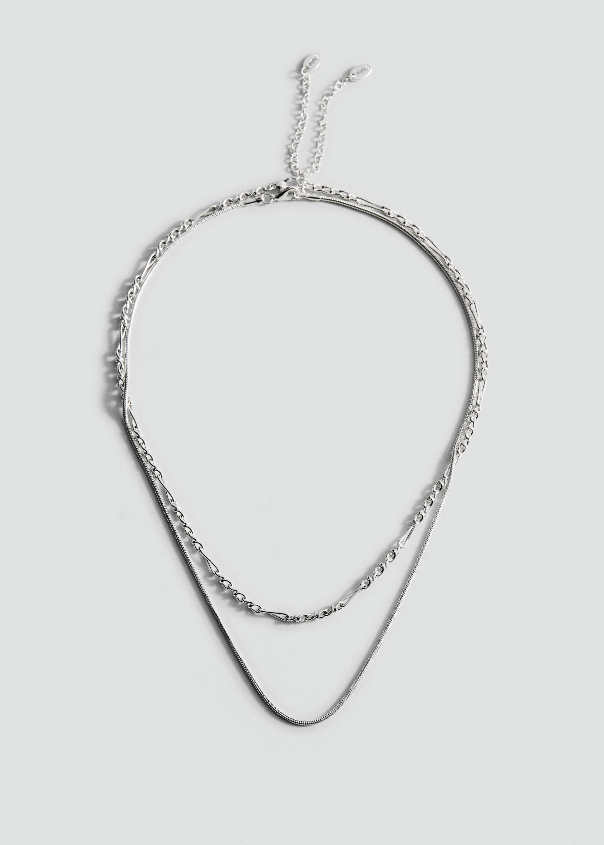 Silver-toned multi-strand collar necklace with a snake chain and textured link chain.