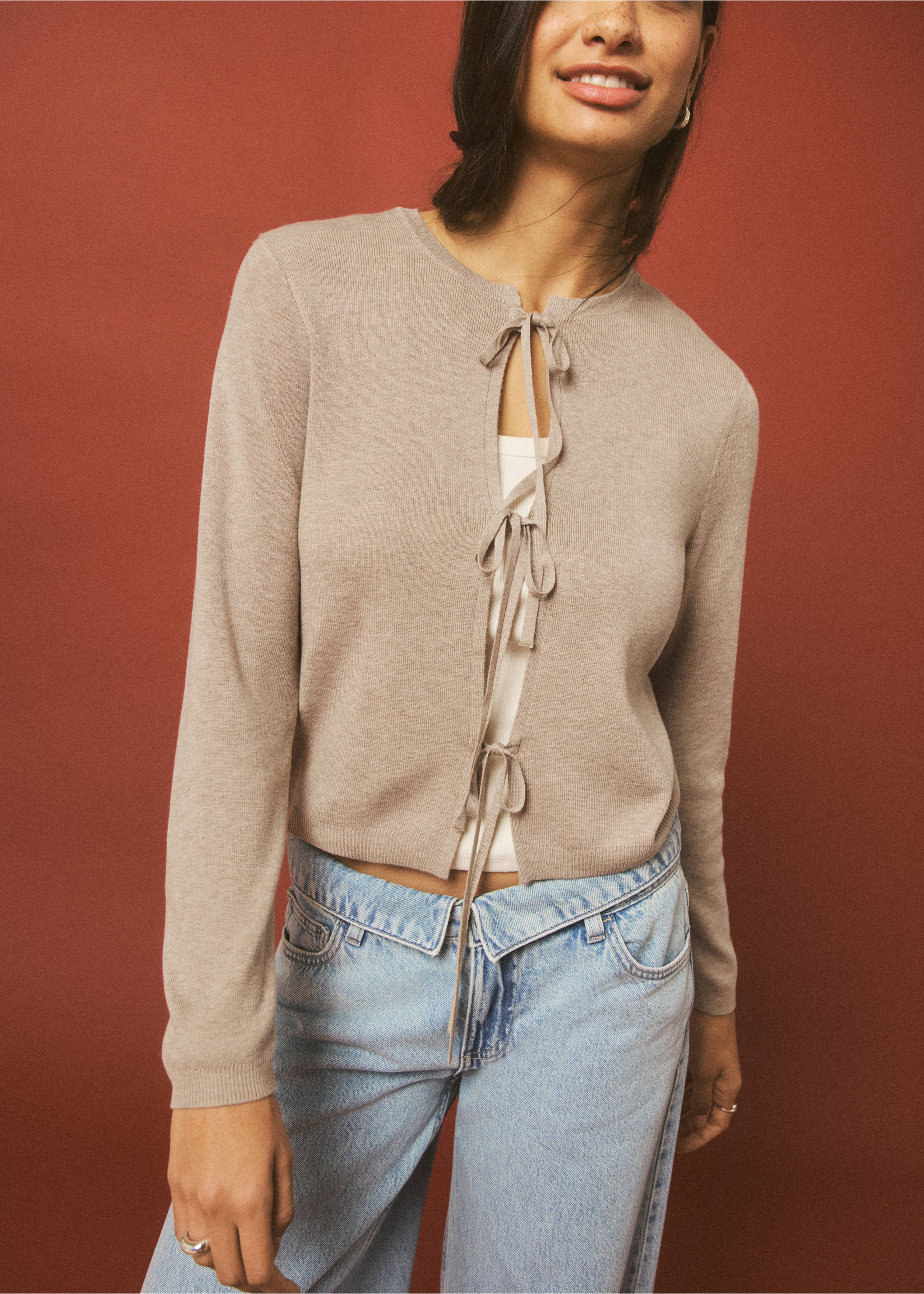 Light brown knit cardigan with front tie bows and a round neck., Sand. Ref: 27044048-00.