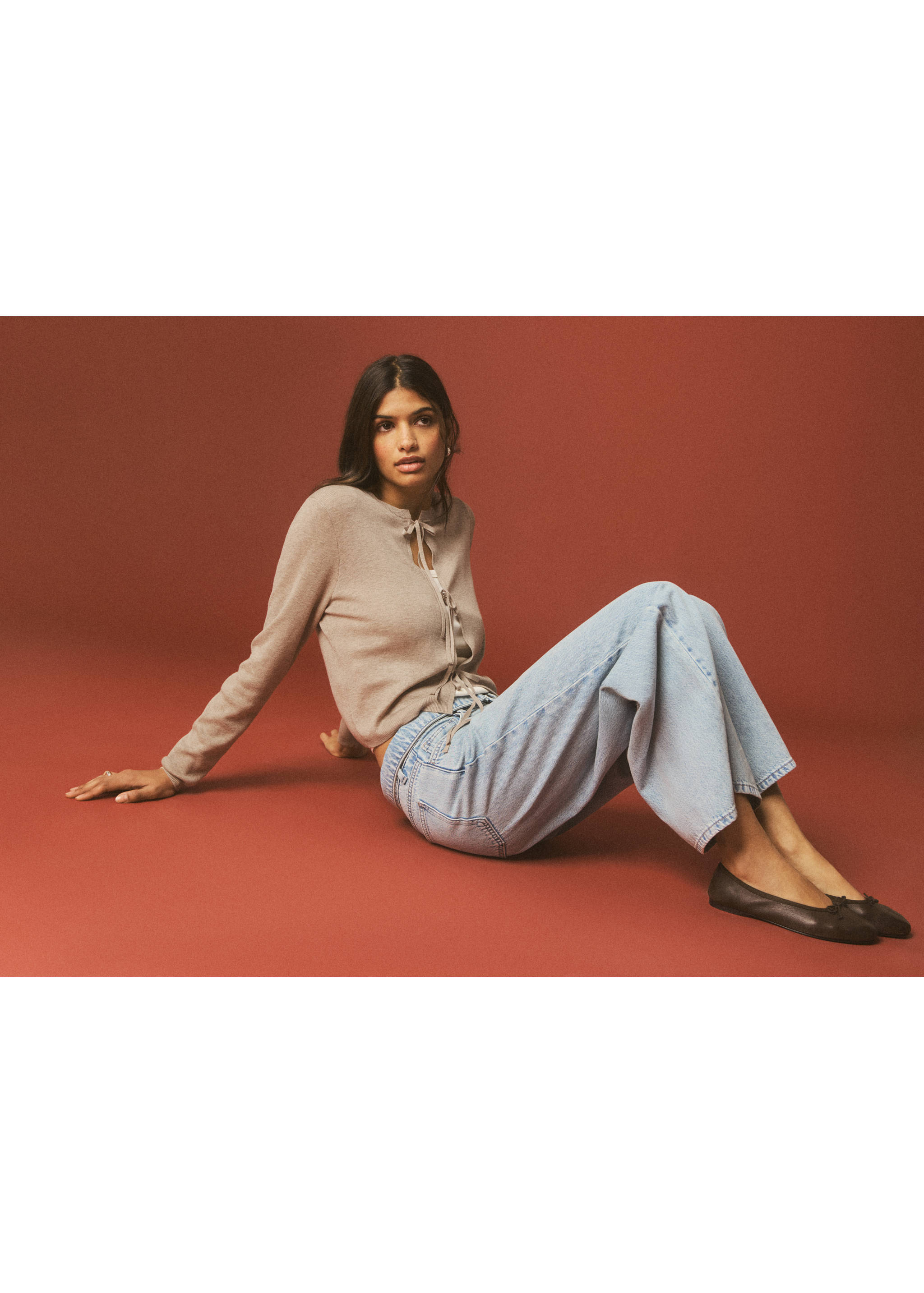 Light brown cardigan with front string ties, worn with light-blue trousers., Sand. Ref: 27044048-00.