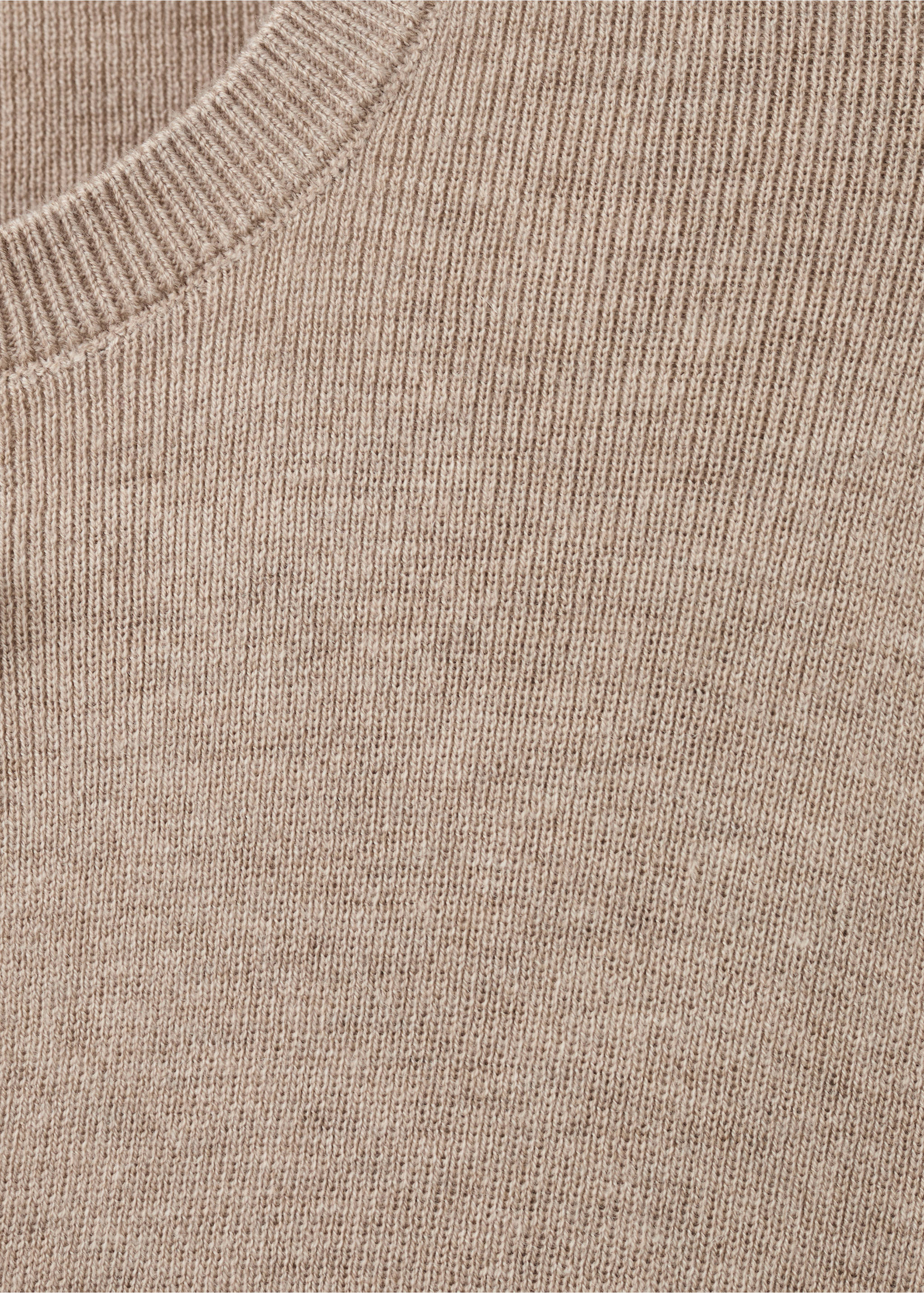 Close-up of the fine-knit fabric and ribbed neckline of a beige cardigan., Sand. Ref: 27044048-00.