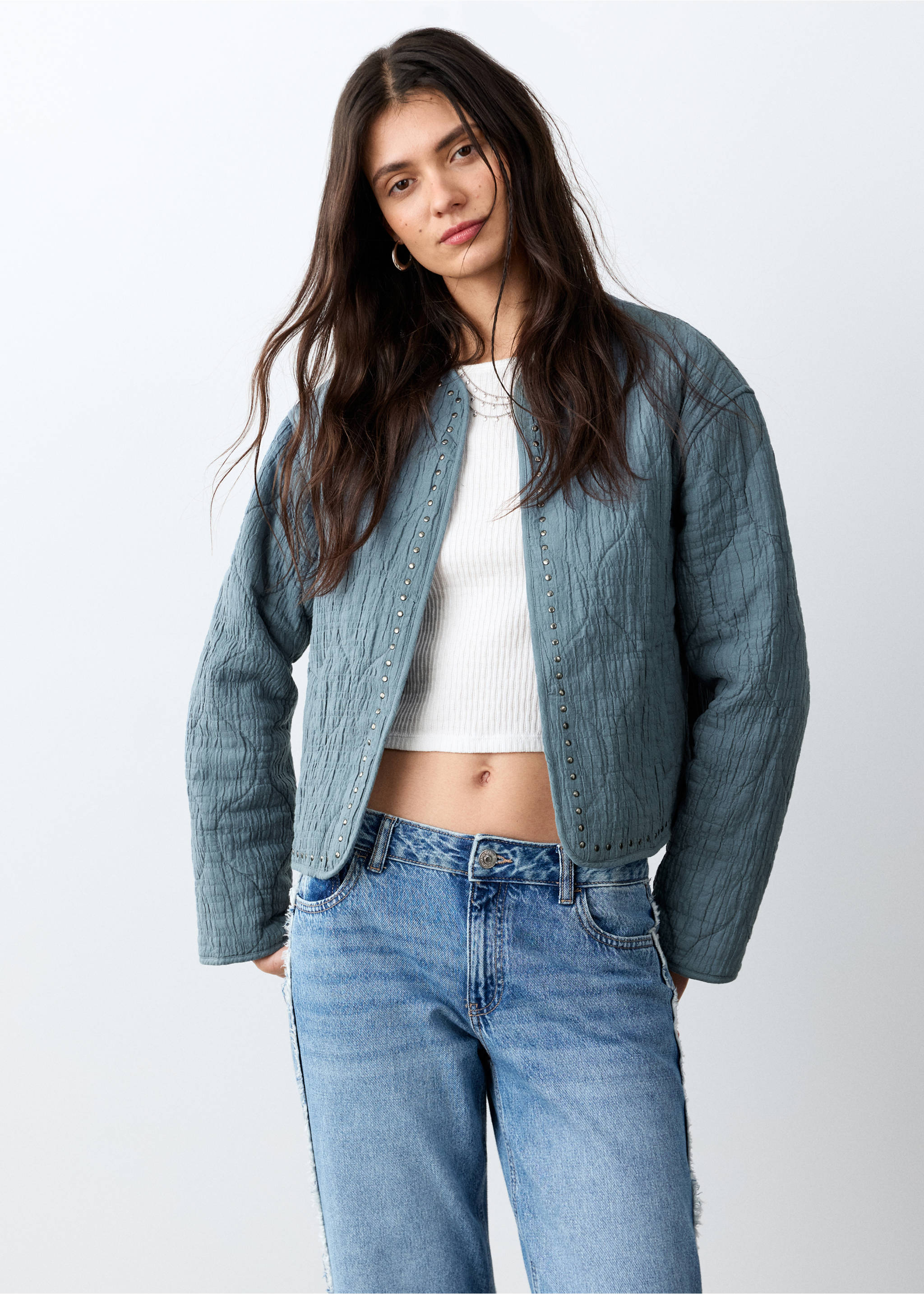 Blue quilted jacket with metallic stud trim and a collarless design., Petrol Blue. Ref: 27045156-00.
