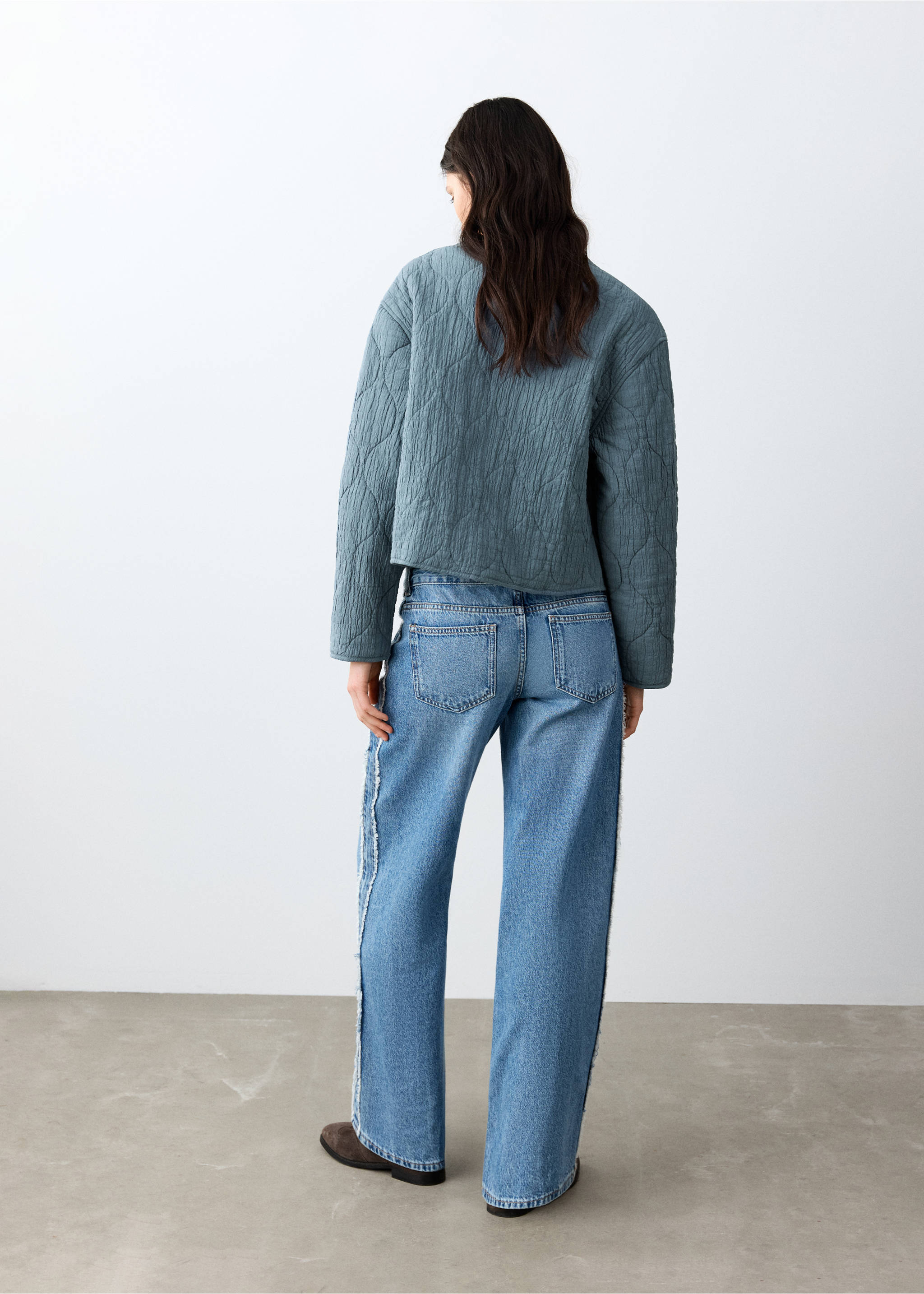 Back view of a grey-blue quilted jacket, worn with blue jeans., Petrol Blue. Ref: 27045156-00.