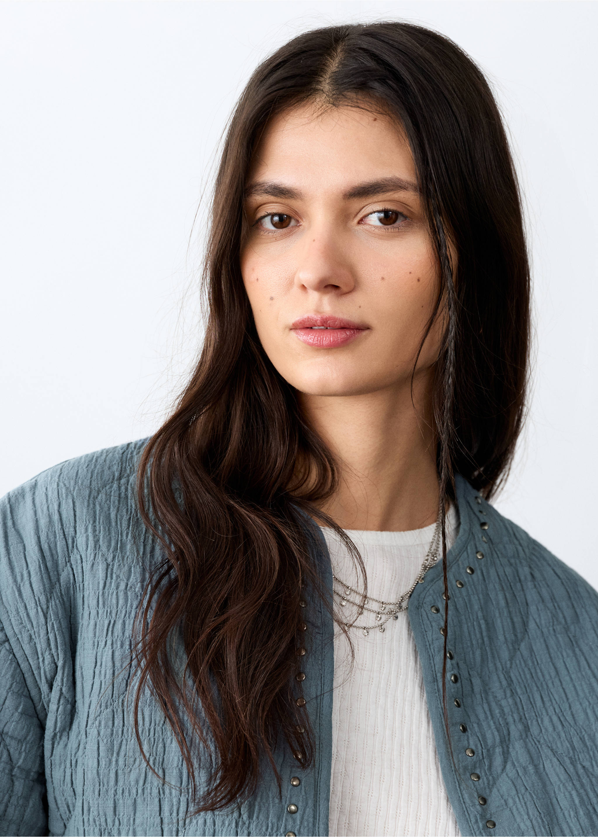 Blue quilted jacket with metallic stud details and a collarless neckline., Petrol Blue. Ref: 27045156-00.