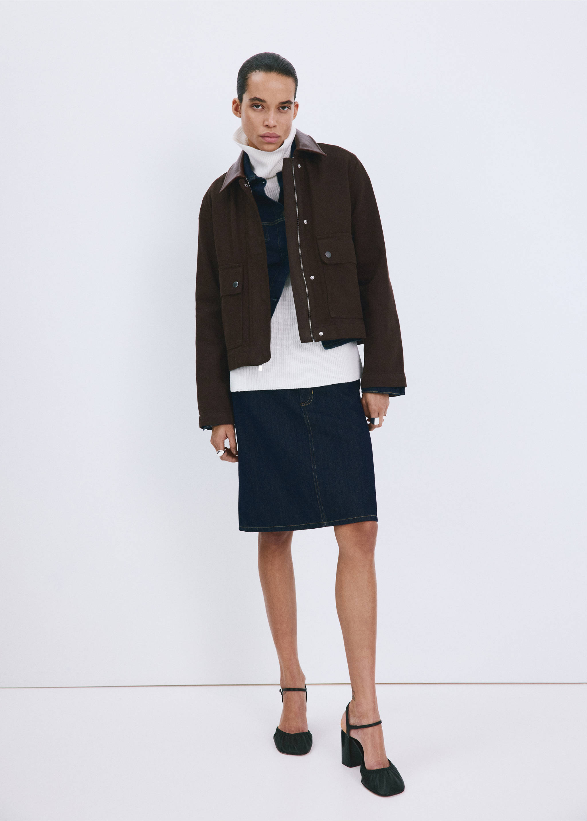 Brown cropped jacket with leather collar worn with a denim jacket, turtleneck, skirt, and heels., Chocolate. Ref: 27045819-00.