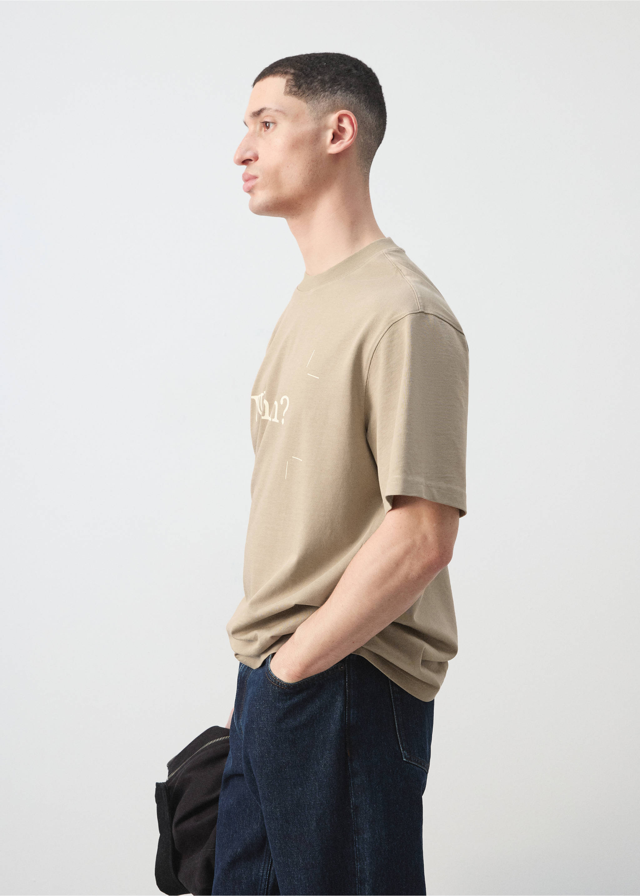 Beige crew-neck T-shirt with short sleeves and graphic text, shown in profile., Beige. Ref: 27045990-00.