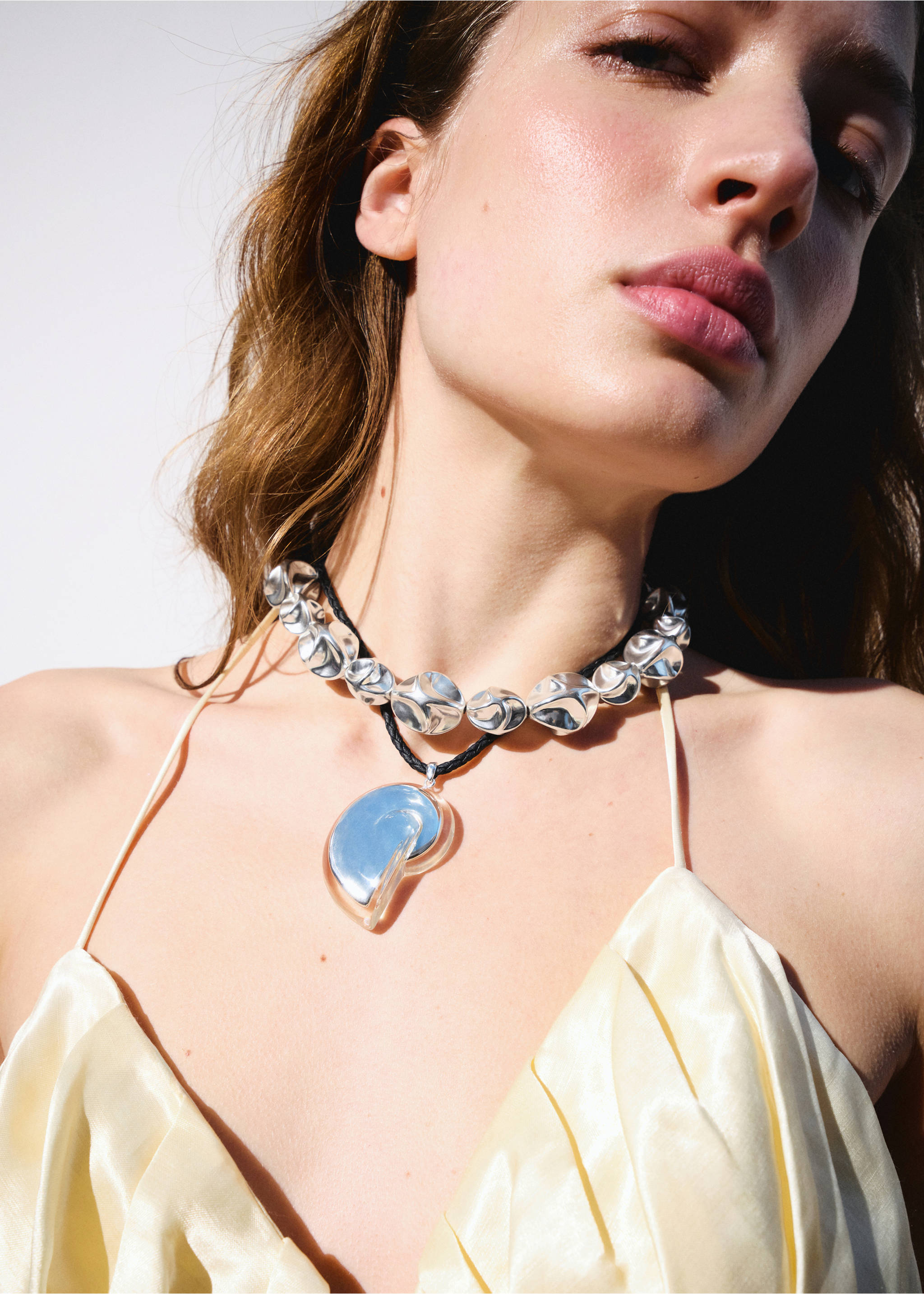 Silver statement collar necklace with faceted beads and a large pendant., Silver. Ref: 27047798-00.