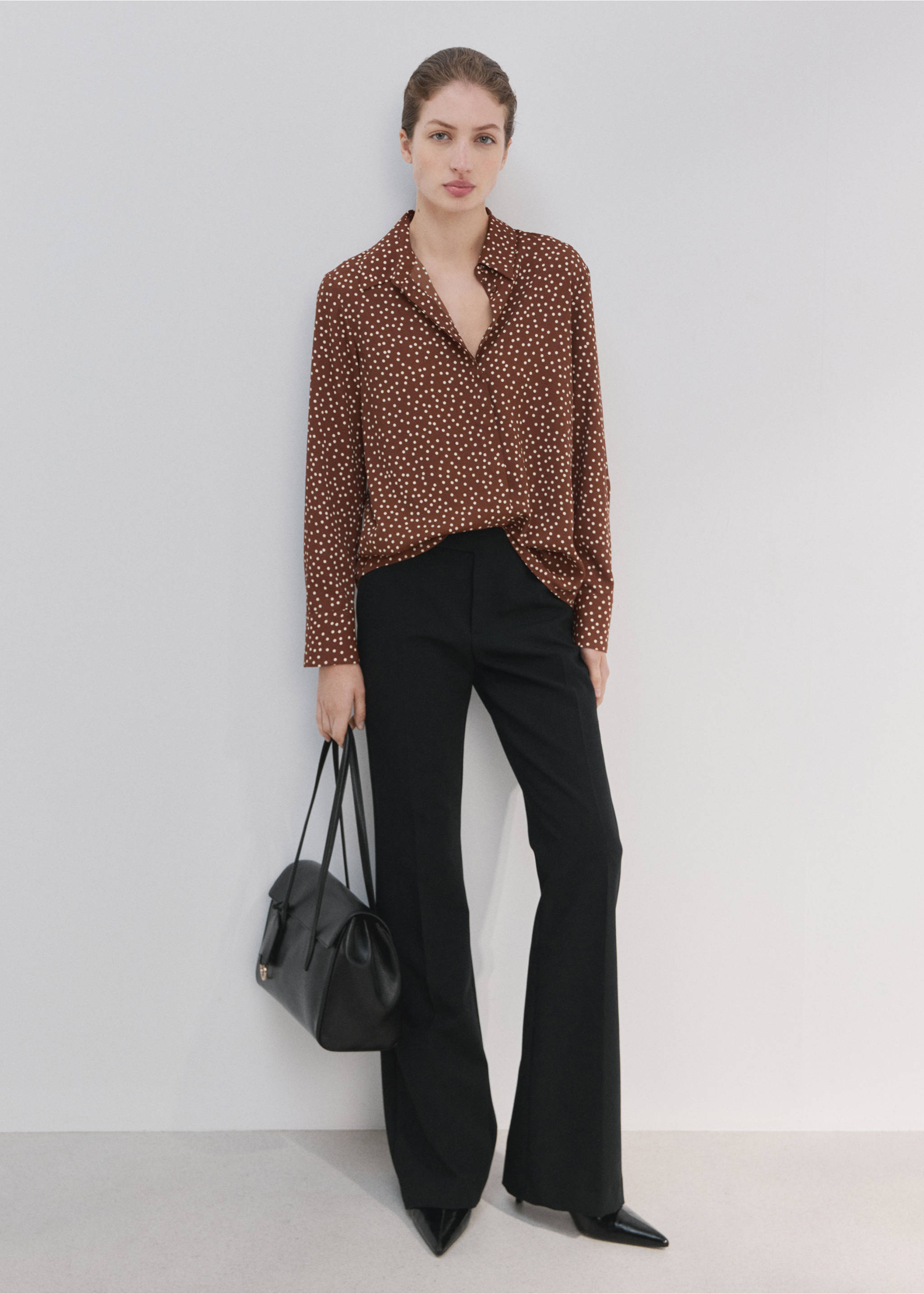 Brown polka-dot shirt with long sleeves and a pointed collar, worn with black trousers., Tobacco Brown. Ref: 27051236-00.