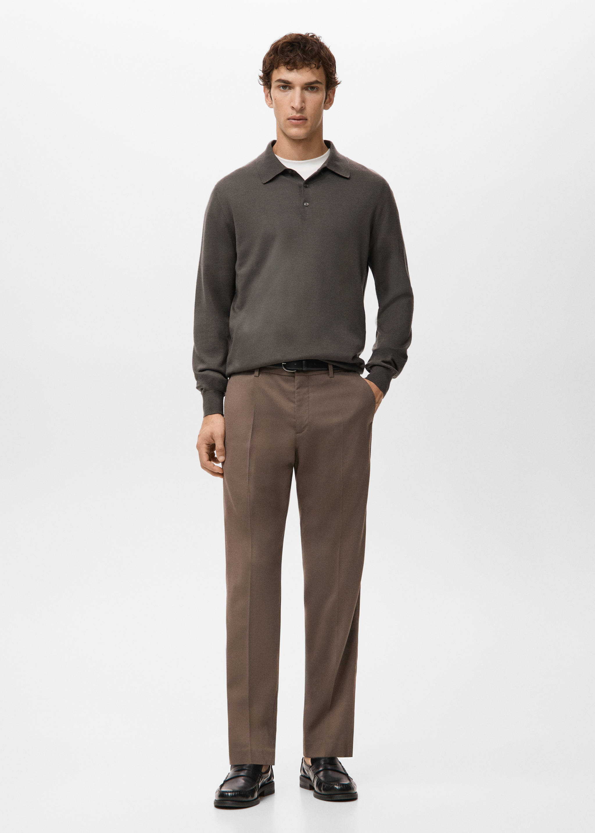 Dark grey long-sleeved knit polo shirt worn with brown trousers