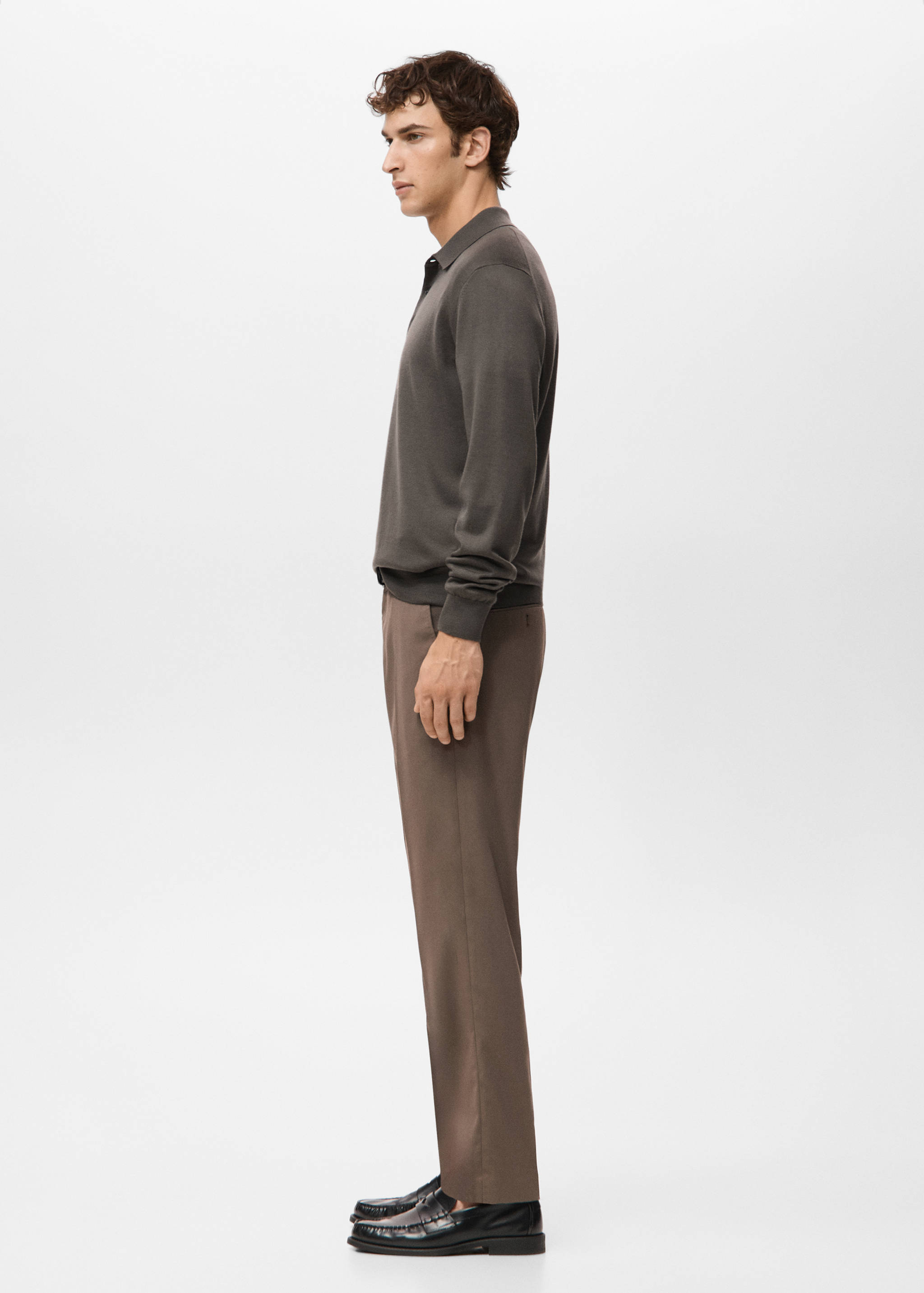 Dark grey long-sleeved knit polo shirt with a classic collar.