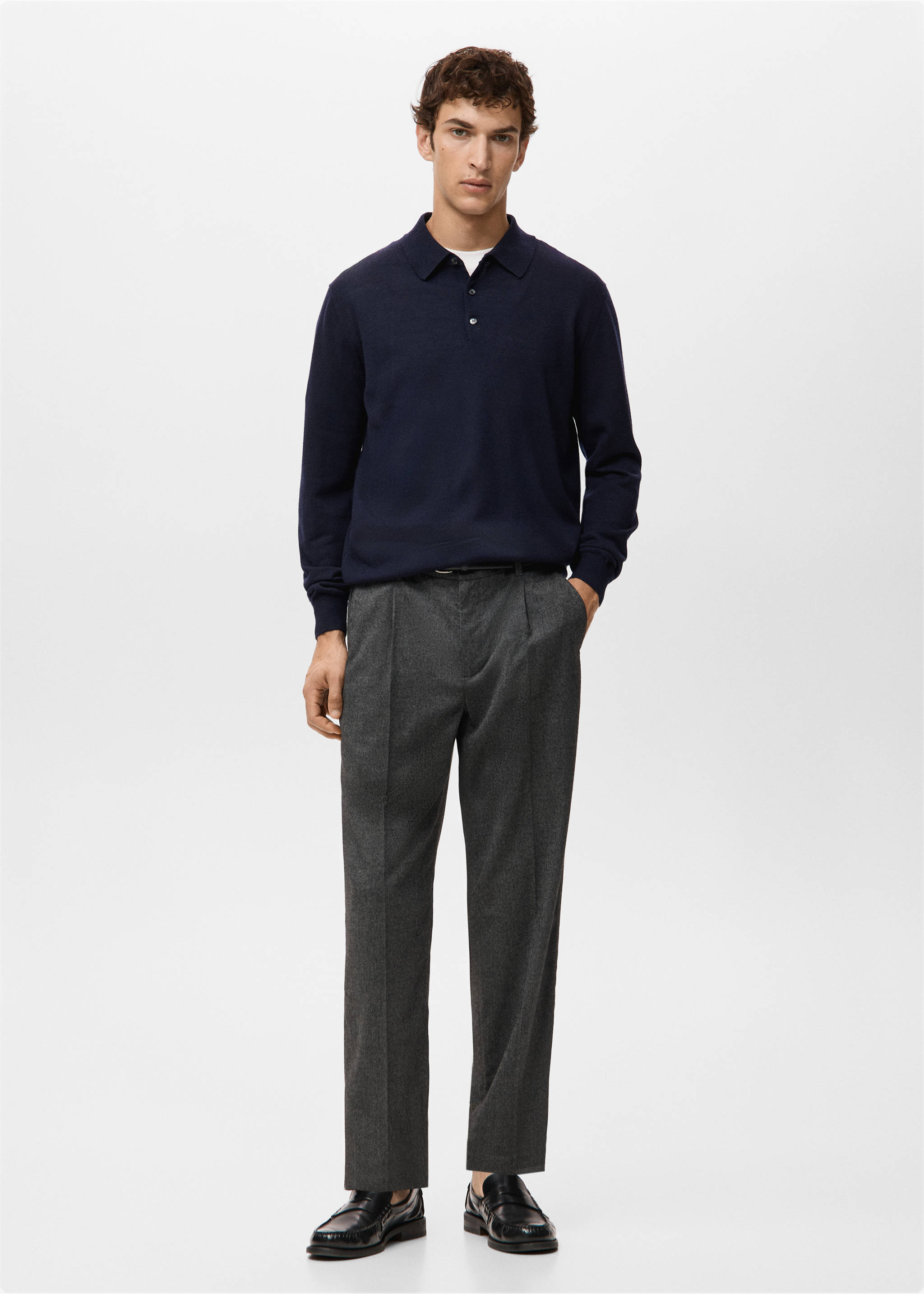 Navy blue long-sleeved knit polo shirt worn with grey trousers., Navy. Ref: 27051283-00.