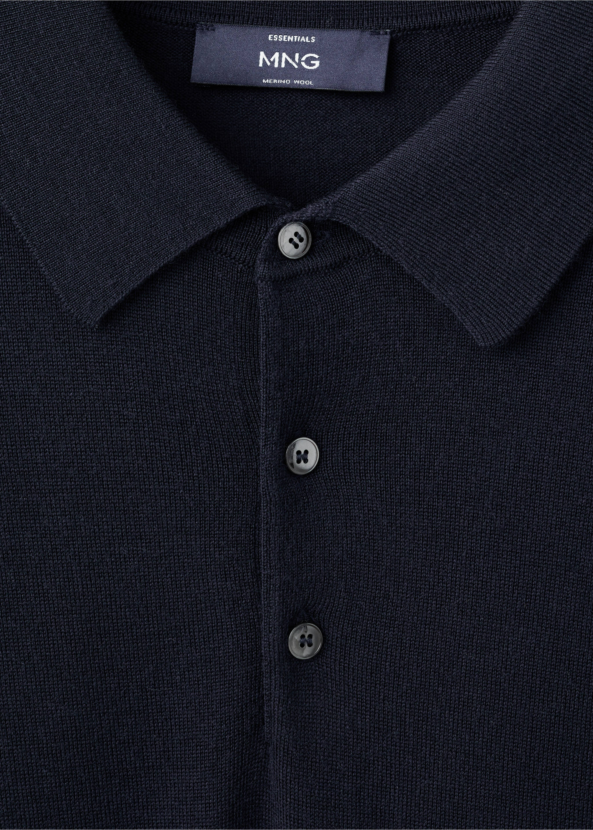 Close-up of a navy merino wool polo shirt collar and button placket., Navy. Ref: 27051283-00.