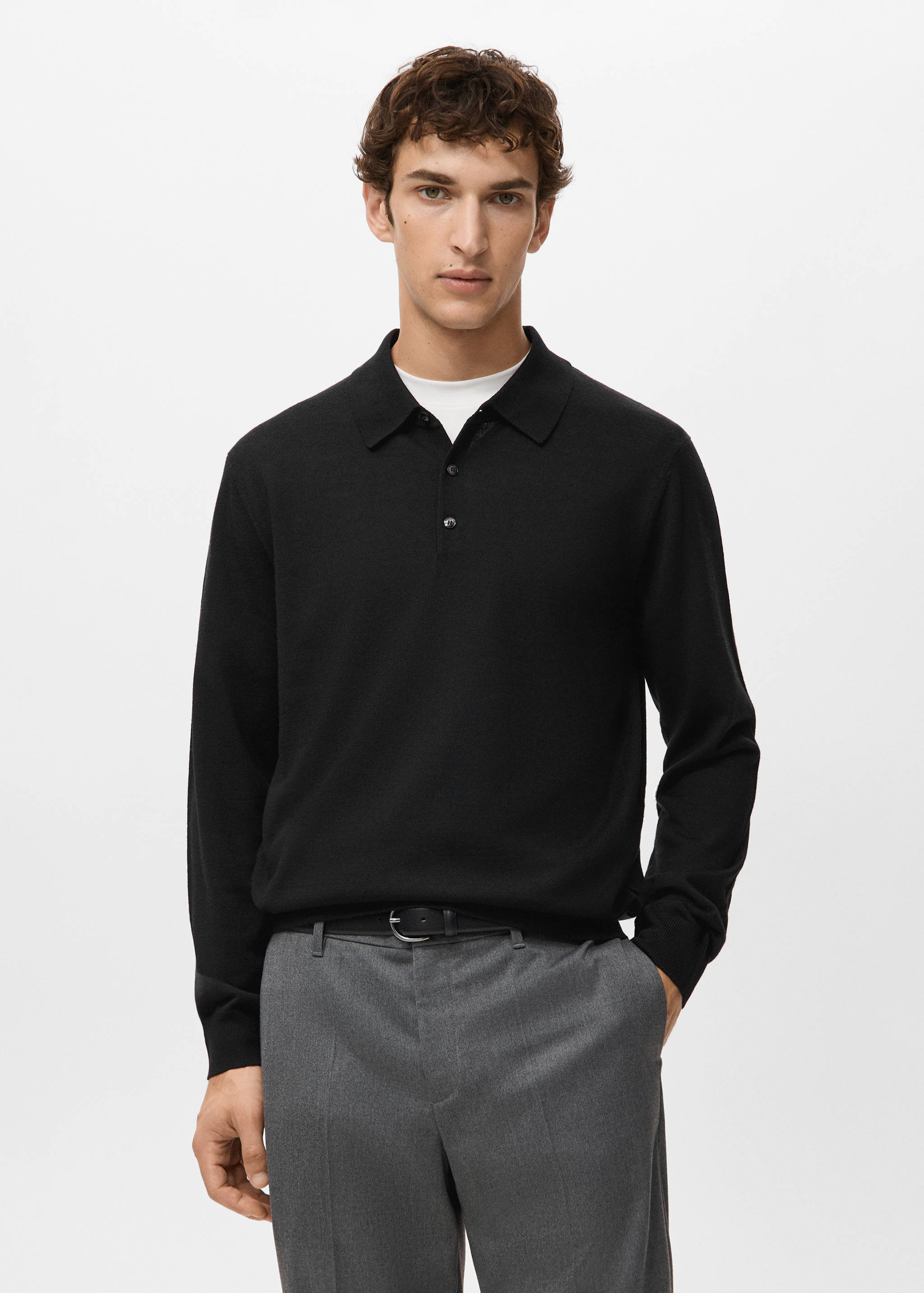 Black long-sleeved knit polo shirt with collar and button placket.