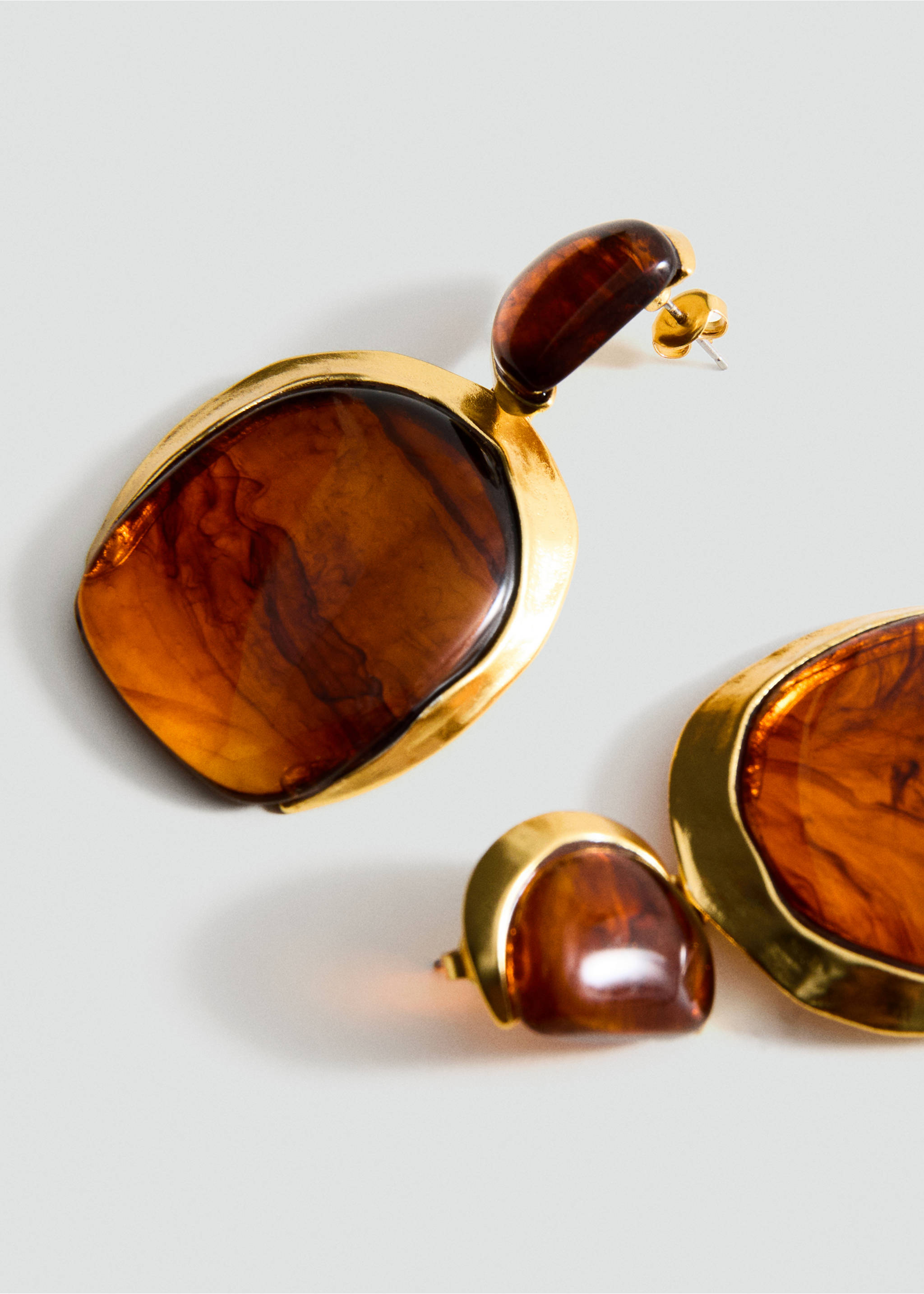 Gold-toned drop earrings with marbled brown resin stones in a three-quarter view., Gold. Ref: 27051292-00.