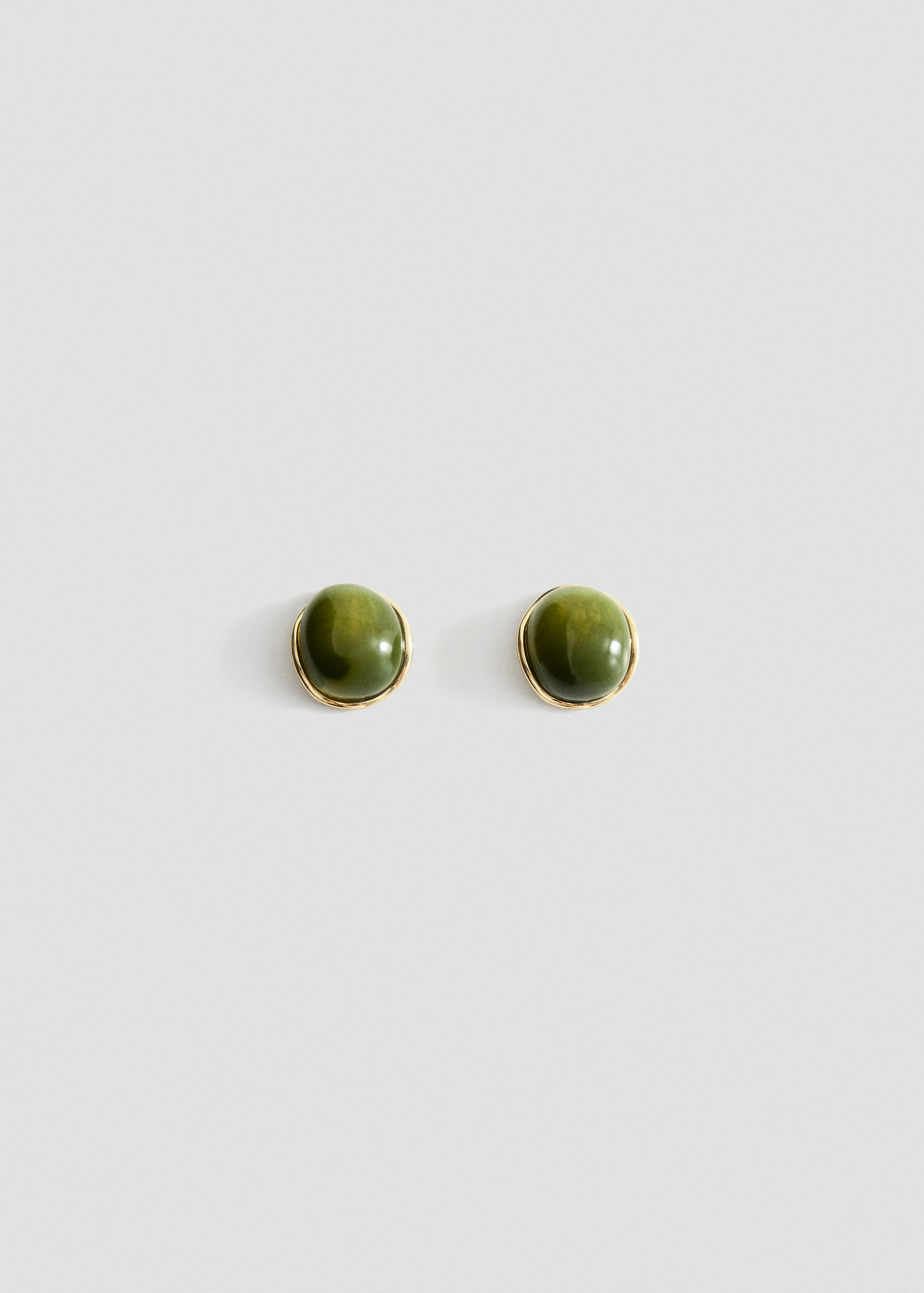 Round olive green earrings with a gold-toned metal setting.