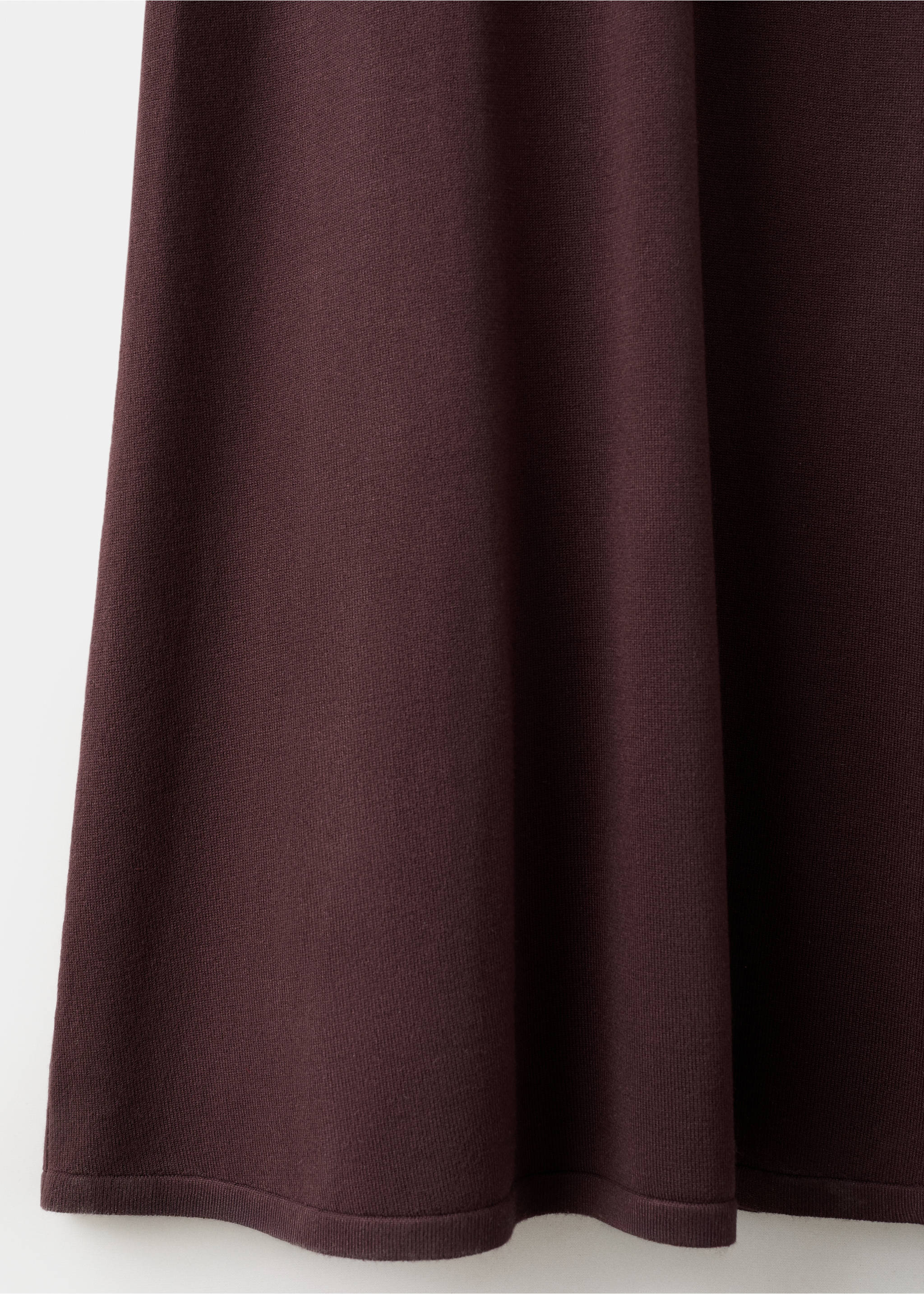 Close-up of the dark burgundy knit fabric texture of a dress., Chocolate. Ref: 27054084-00.