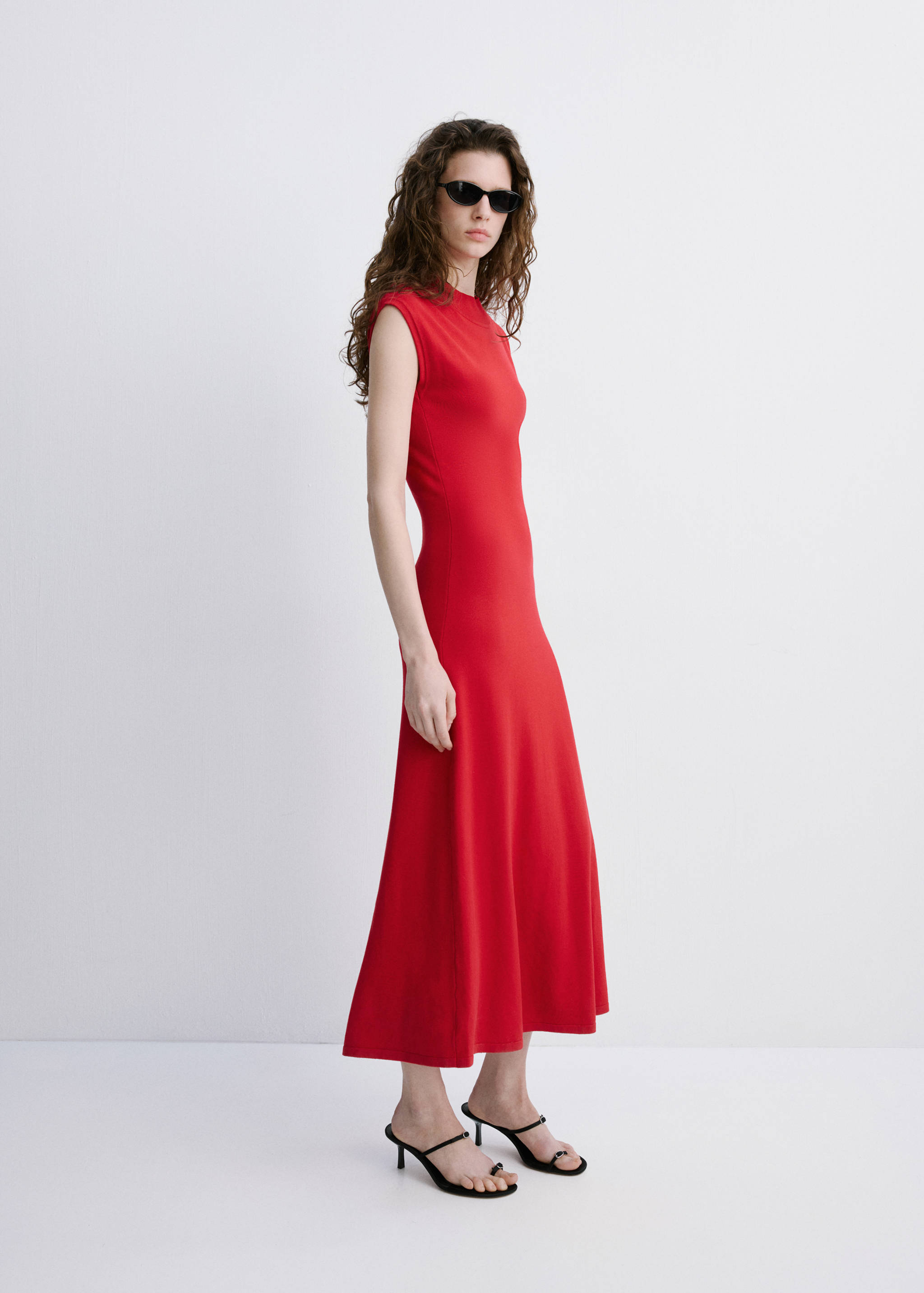 Bright red sleeveless midi dress with a round neckline and flared skirt.