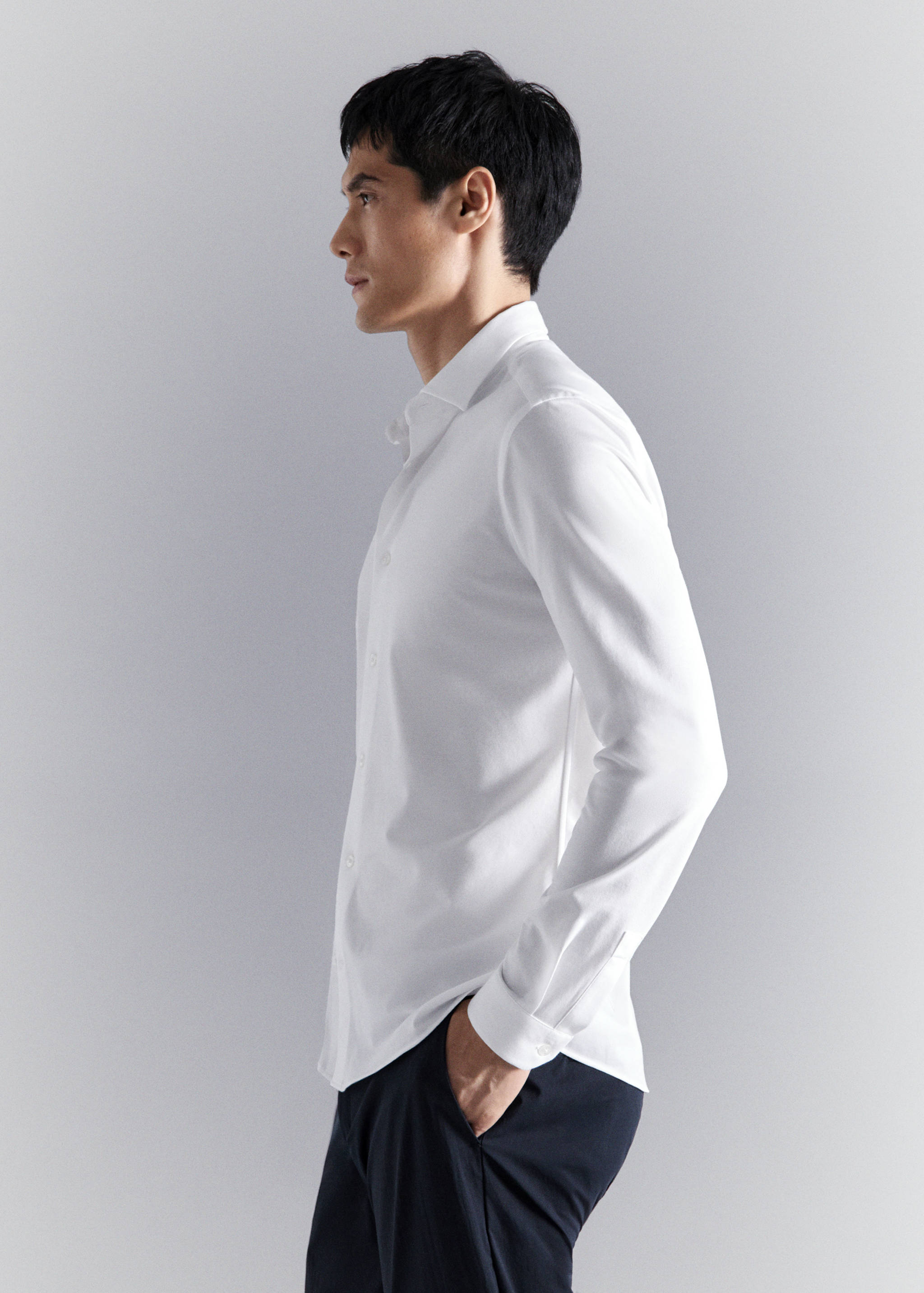 White long-sleeved shirt with a classic collar.