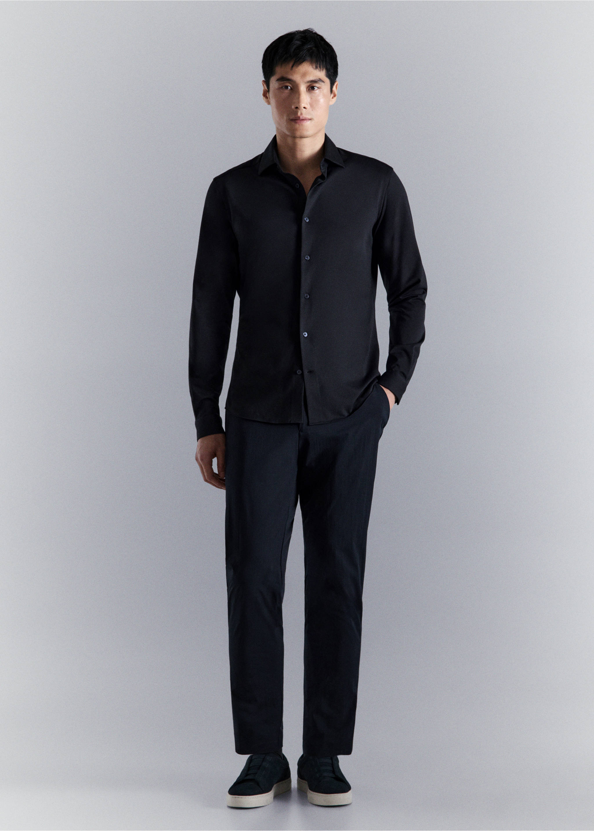 Black long-sleeved shirt with a classic collar and button fastening, worn with matching trousers., Navy. Ref: 27054422-00.