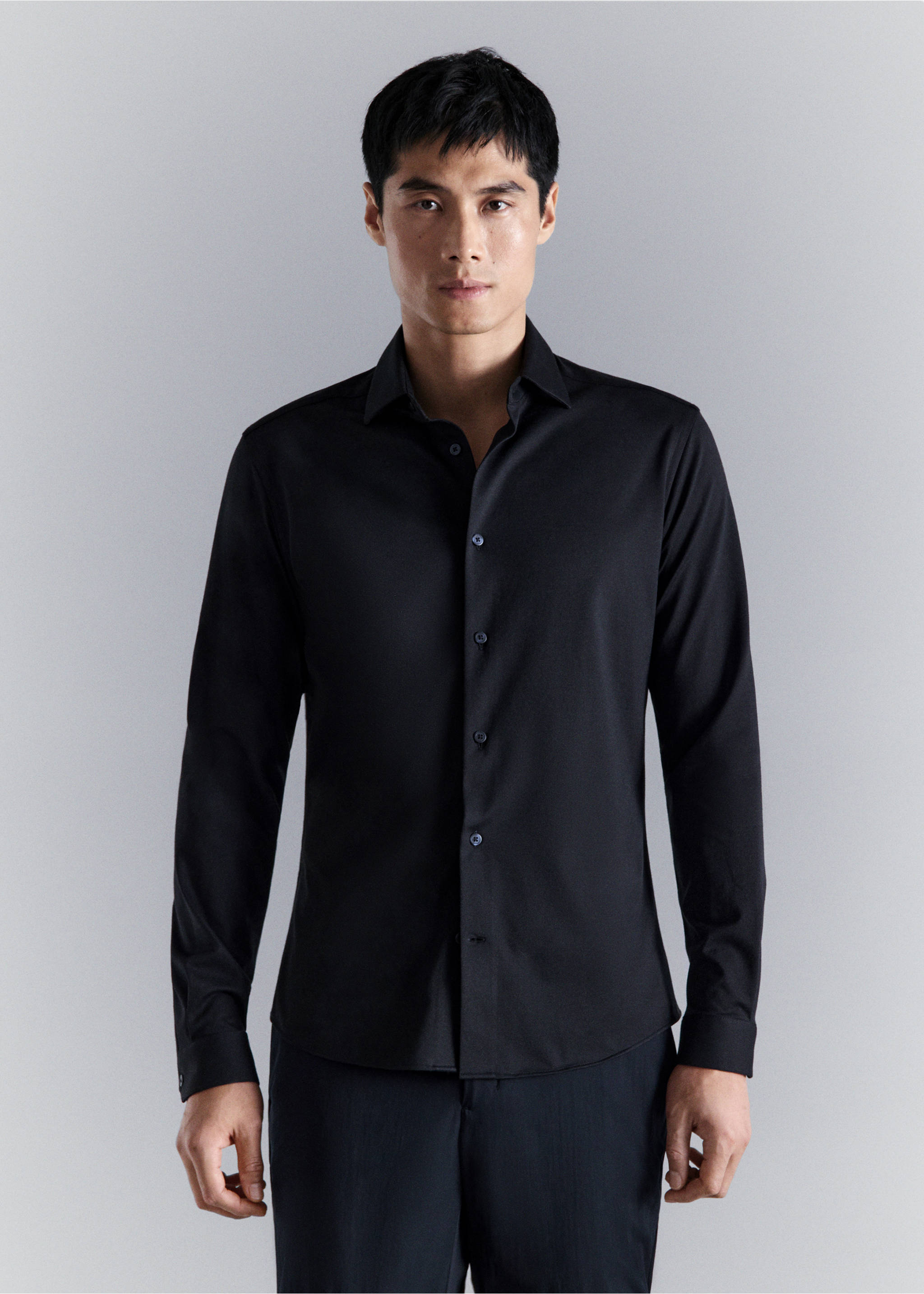 Black long-sleeved shirt with a classic collar and front buttons., Navy. Ref: 27054422-00.