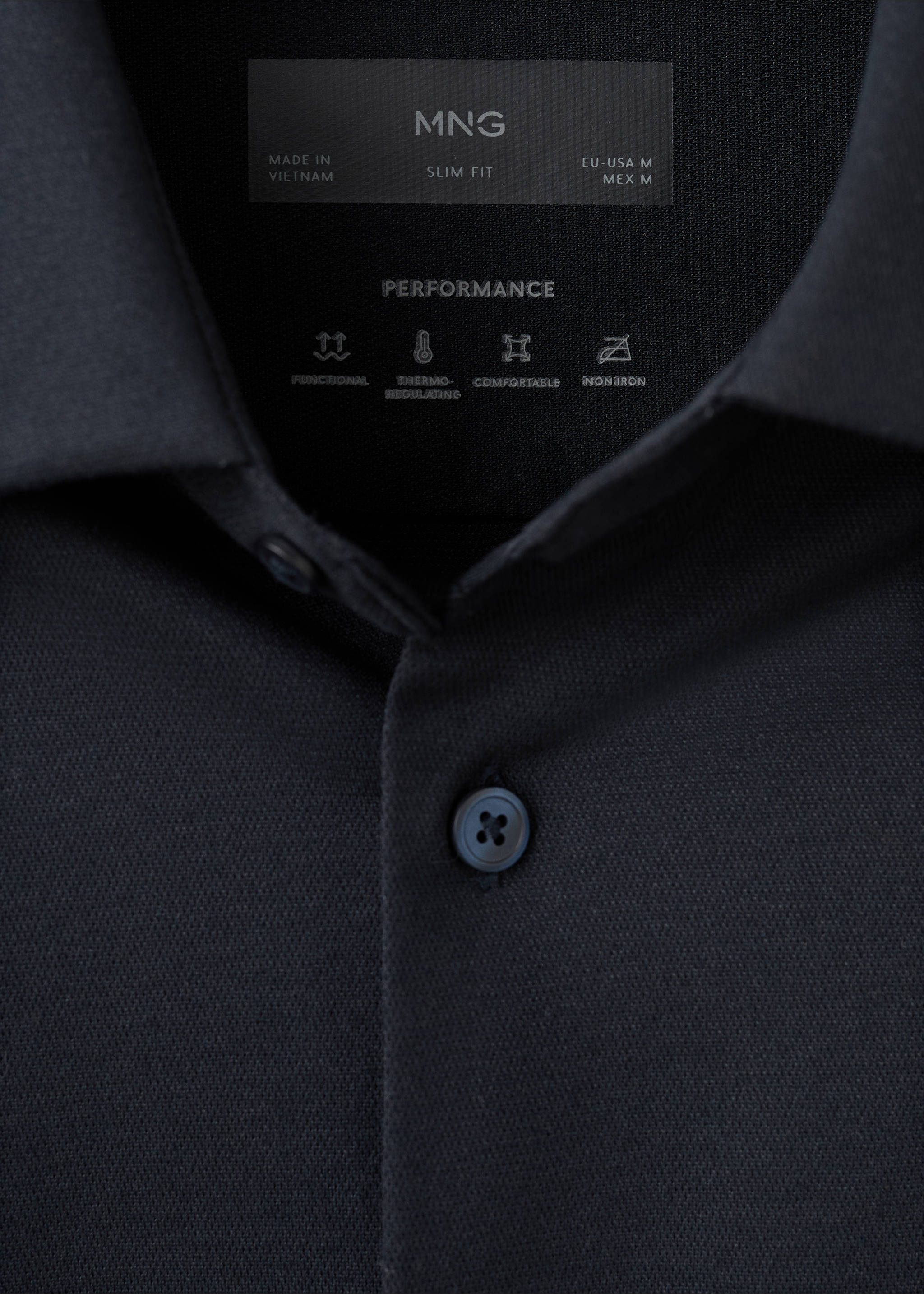 Close-up of a black slim-fit shirt collar showing the inner performance label., Navy. Ref: 27054422-00.