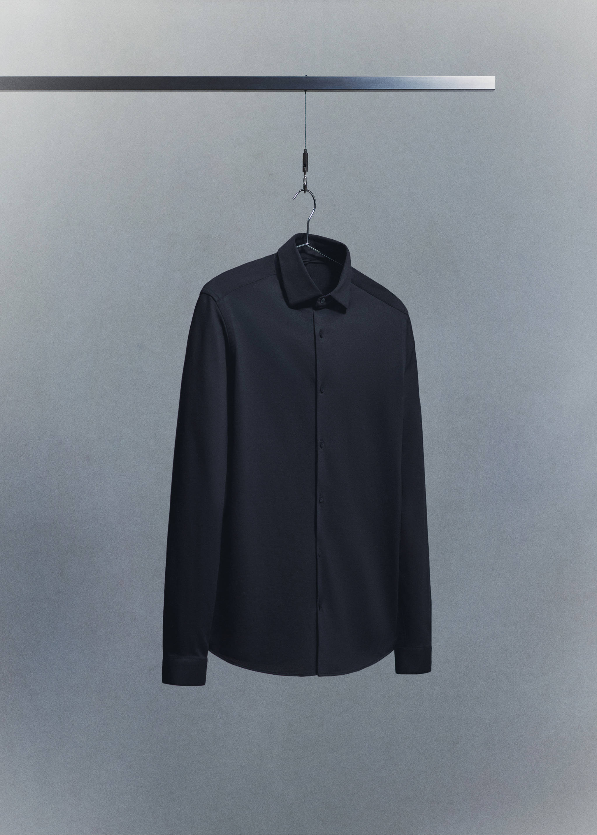 Black long-sleeved shirt with a pointed collar and buttoned front., Navy. Ref: 27054422-00.