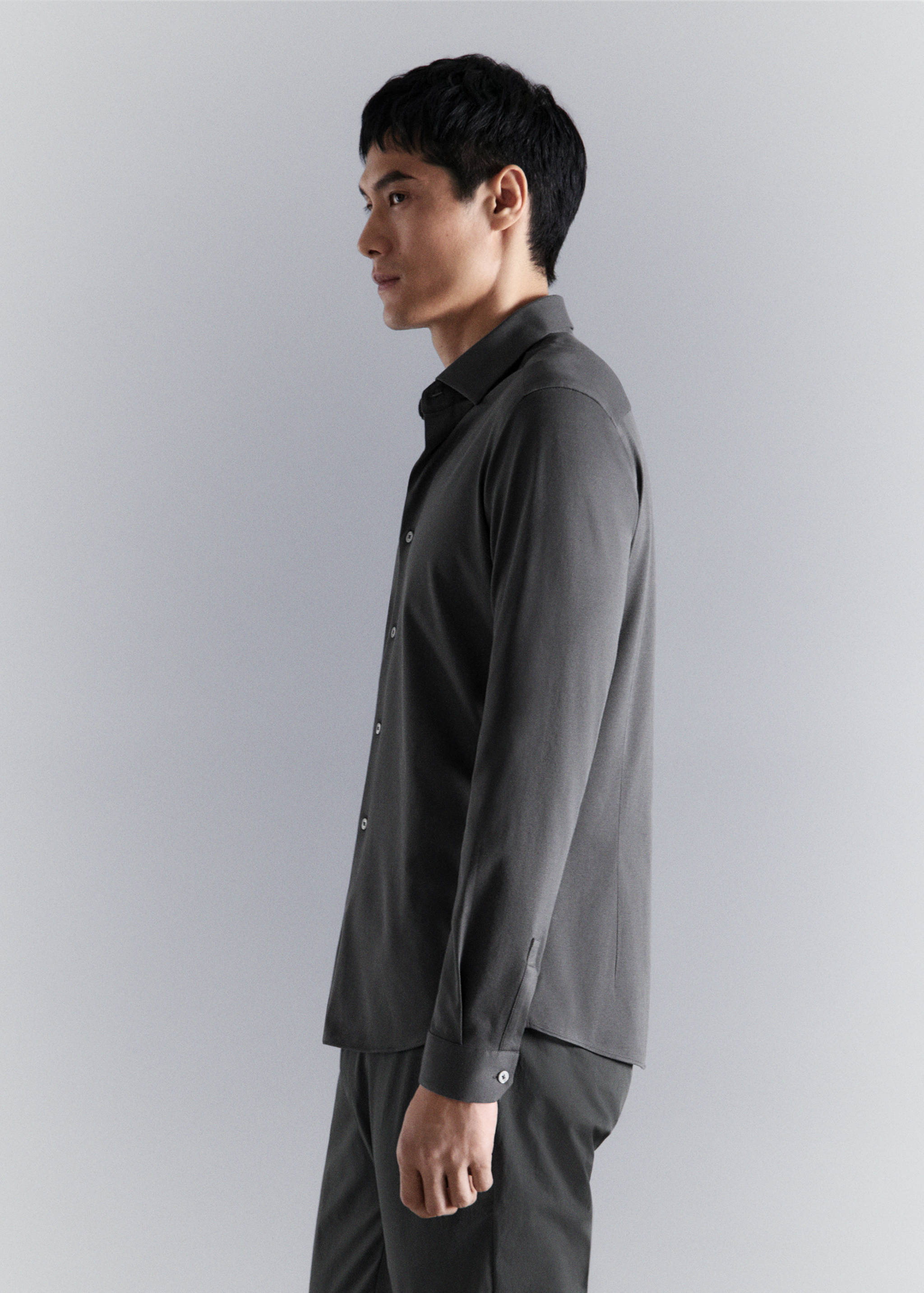 Dark grey long-sleeved shirt with classic collar and front buttons.