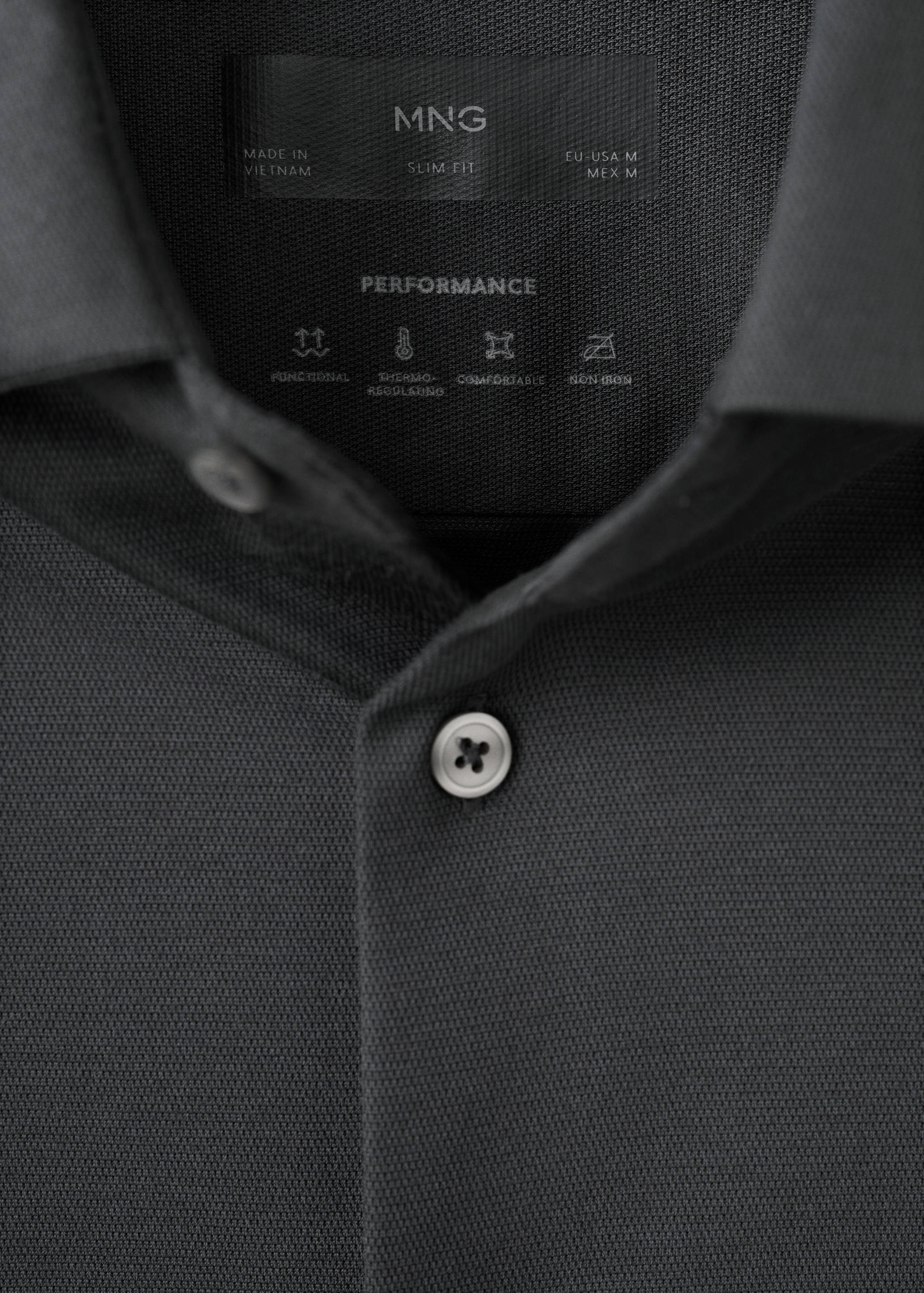 Dark grey slim fit performance shirt collar detail.