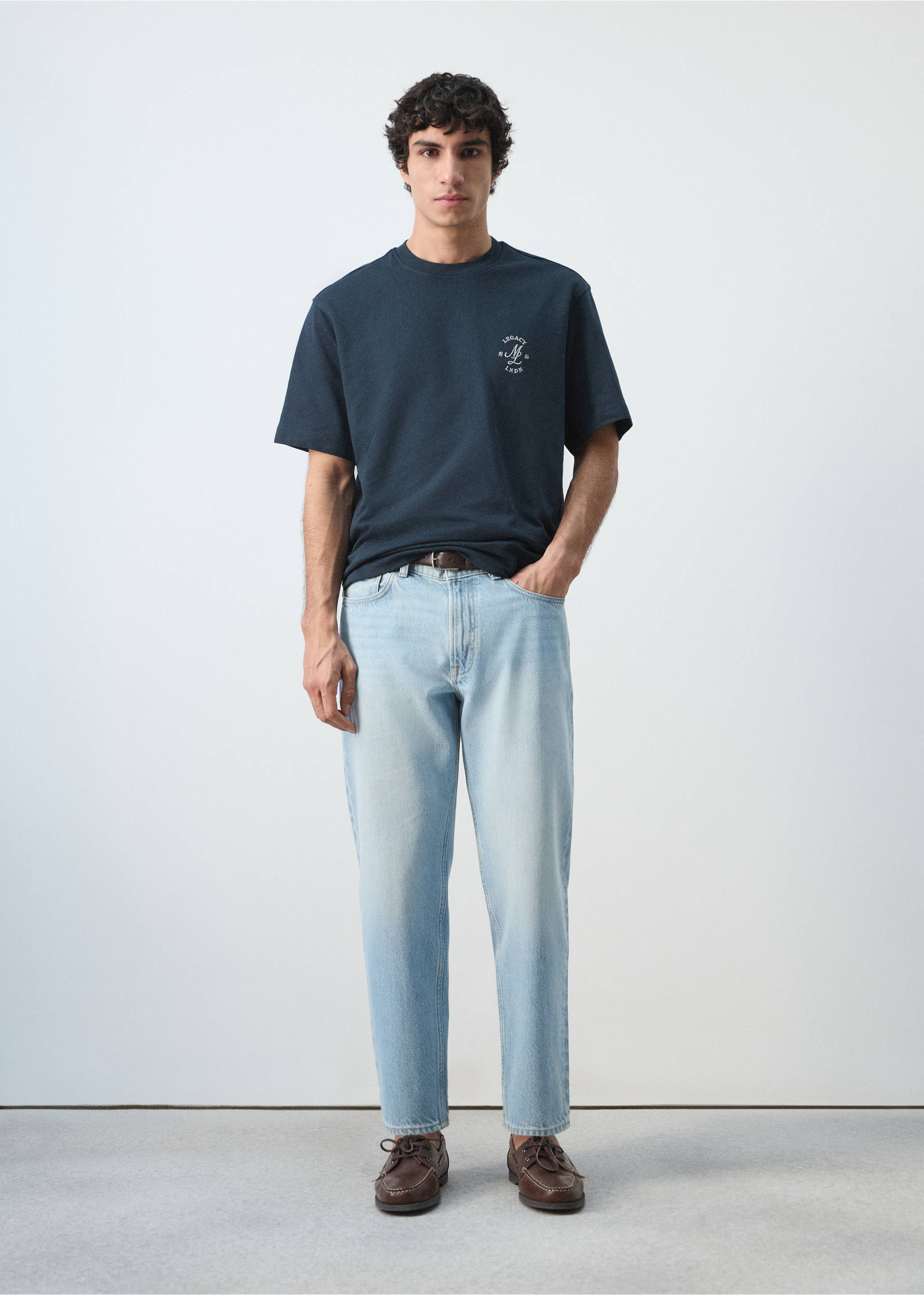 Navy blue short-sleeved crew neck t-shirt with a small chest graphic., Navy. Ref: 27054438-00.