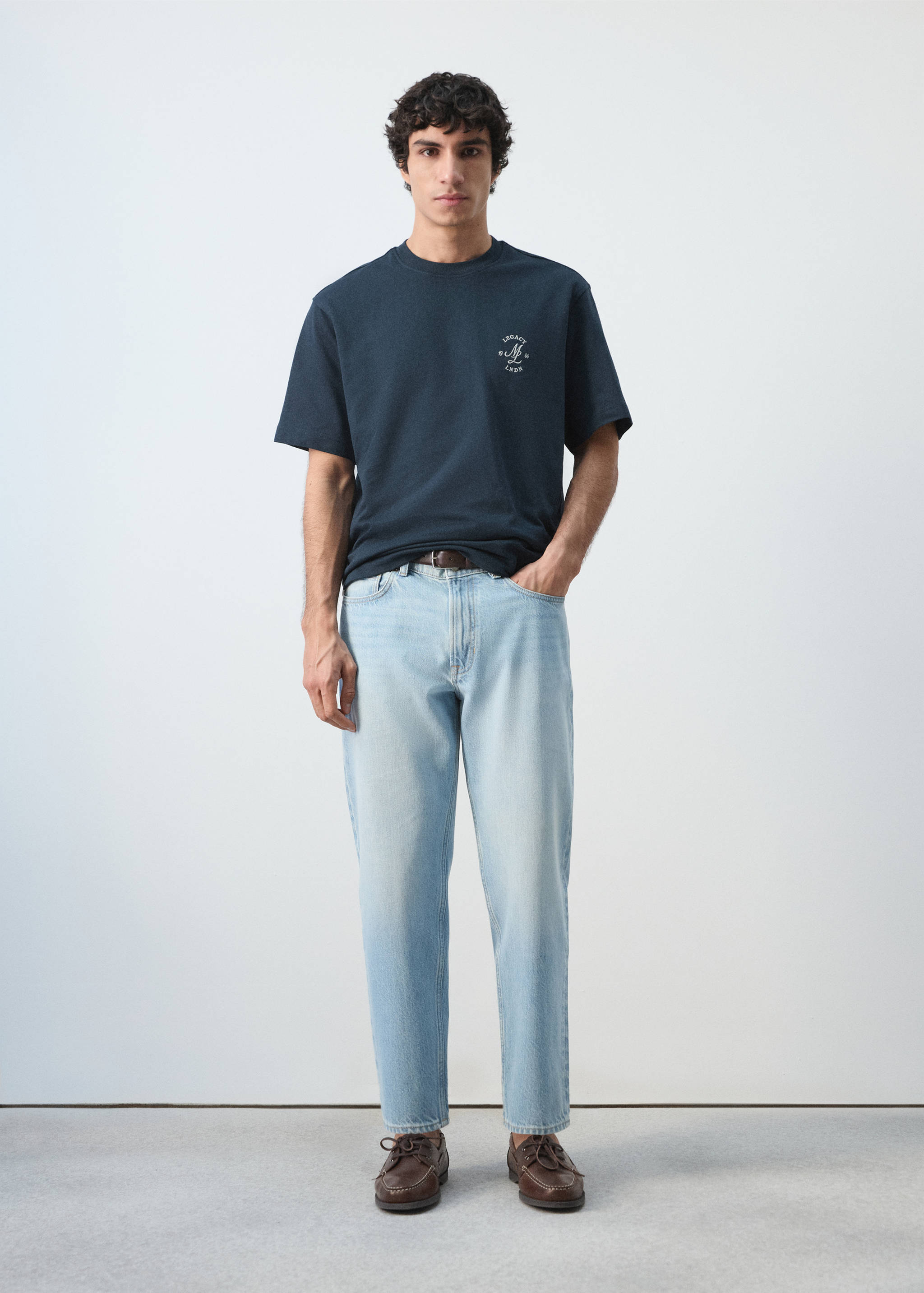 Navy blue short-sleeved crew neck t-shirt with a small chest graphic.