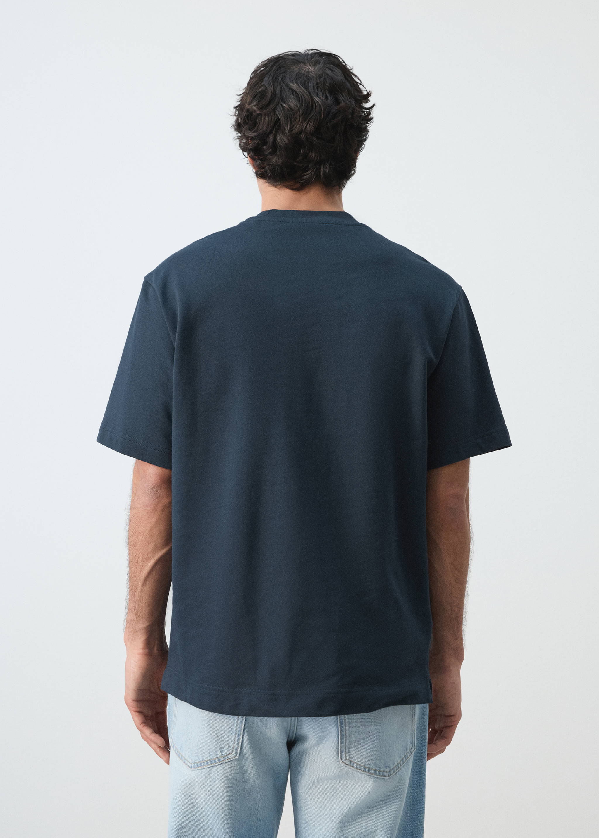 Back view of a dark navy blue short-sleeve t-shirt with a relaxed fit.