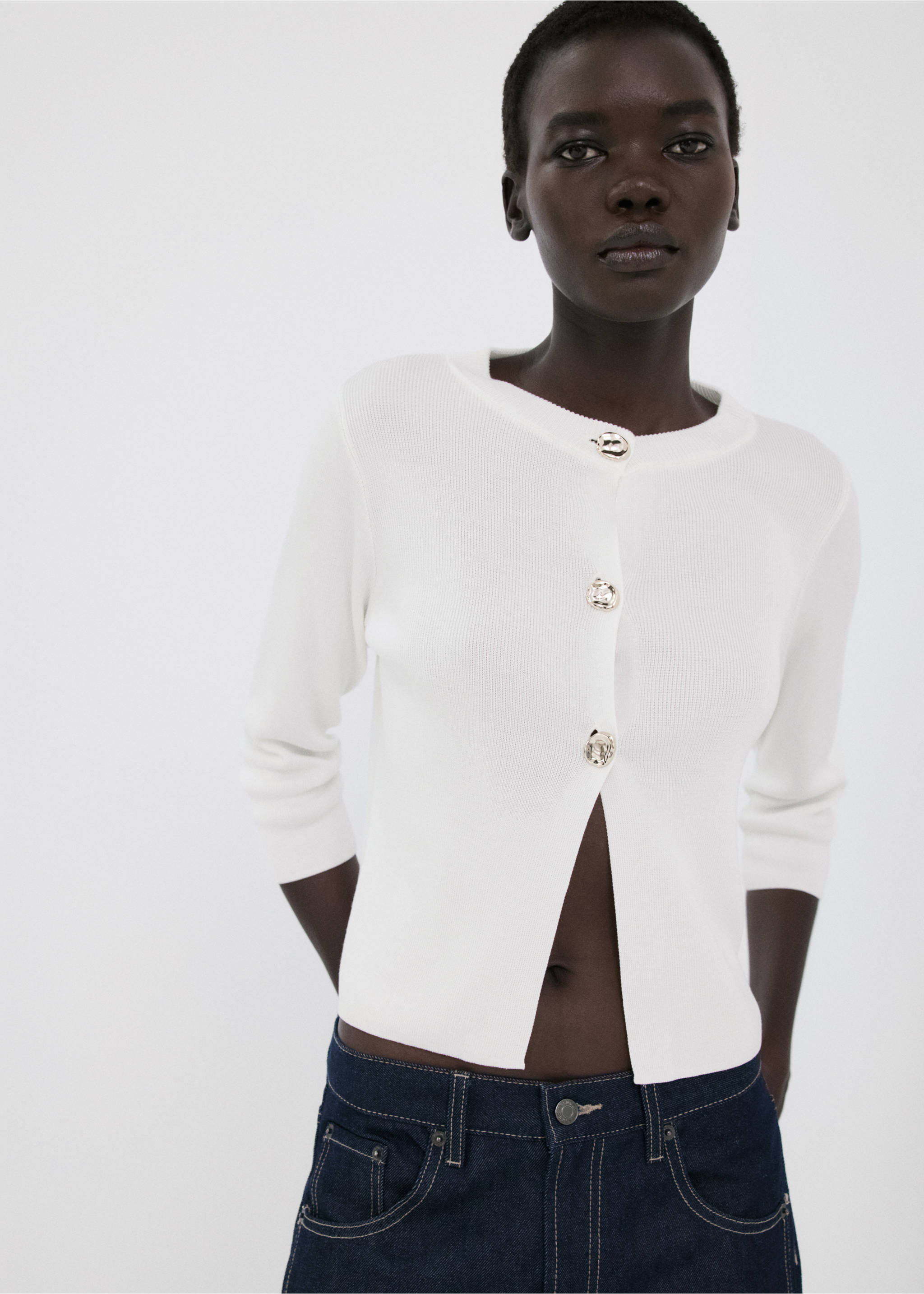 White ribbed knit cardigan with round neck and ornate silver buttons., Ecru. Ref: 27055822-00.