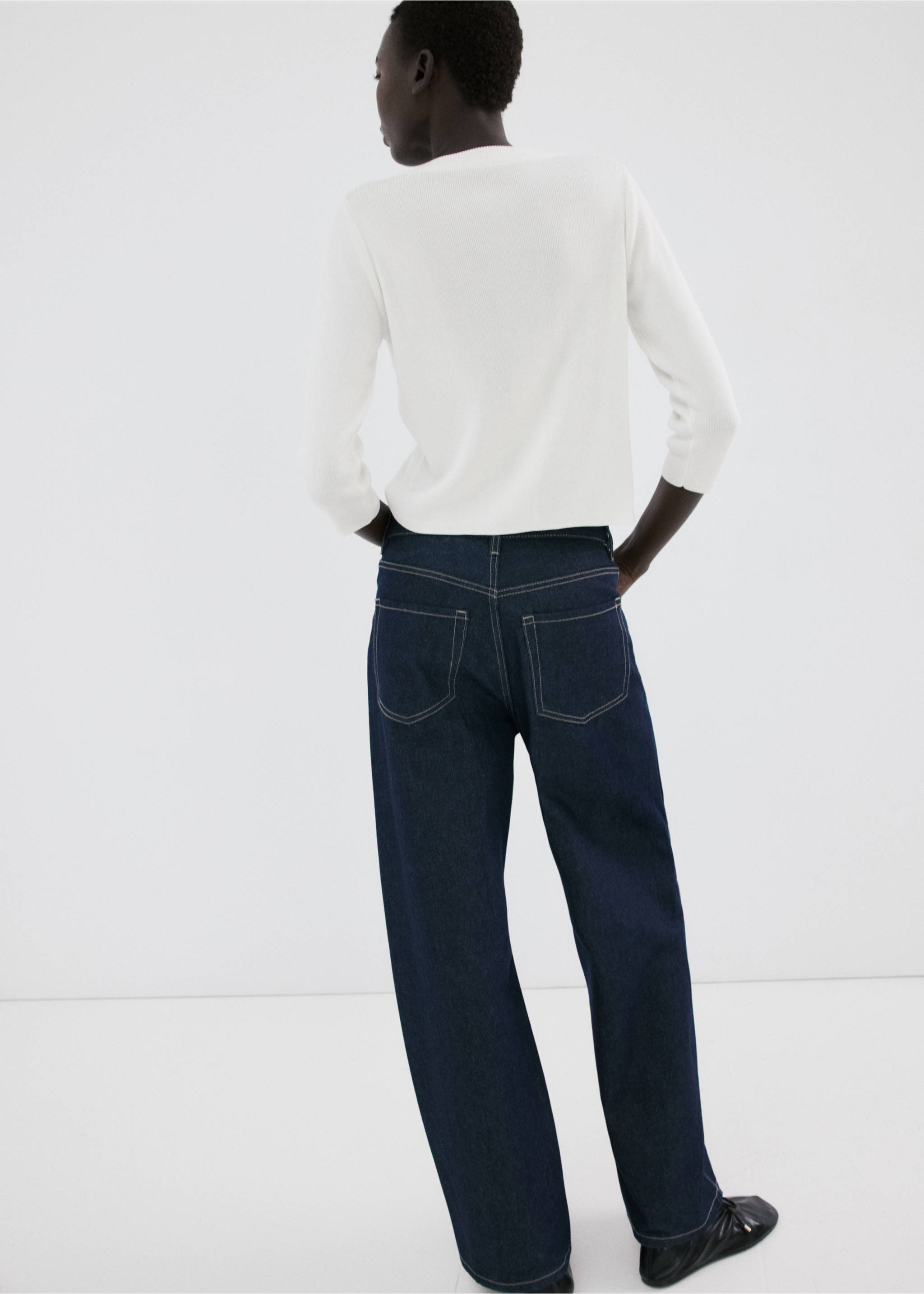 Back view of a white cardigan worn with dark blue denim trousers., Ecru. Ref: 27055822-00.