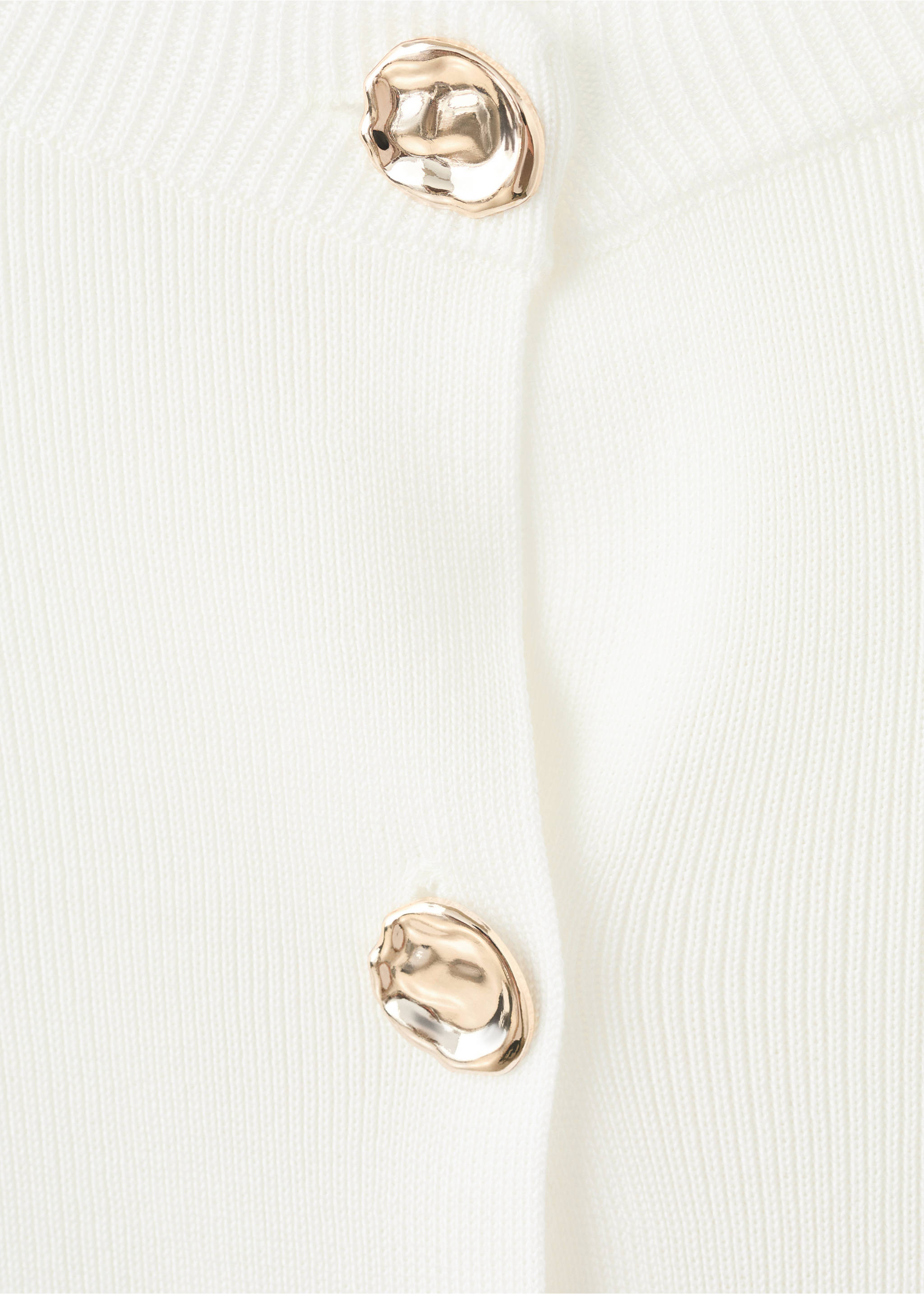 Close-up of a white cardigan featuring ornate gold metallic buttons., Ecru. Ref: 27055822-00.