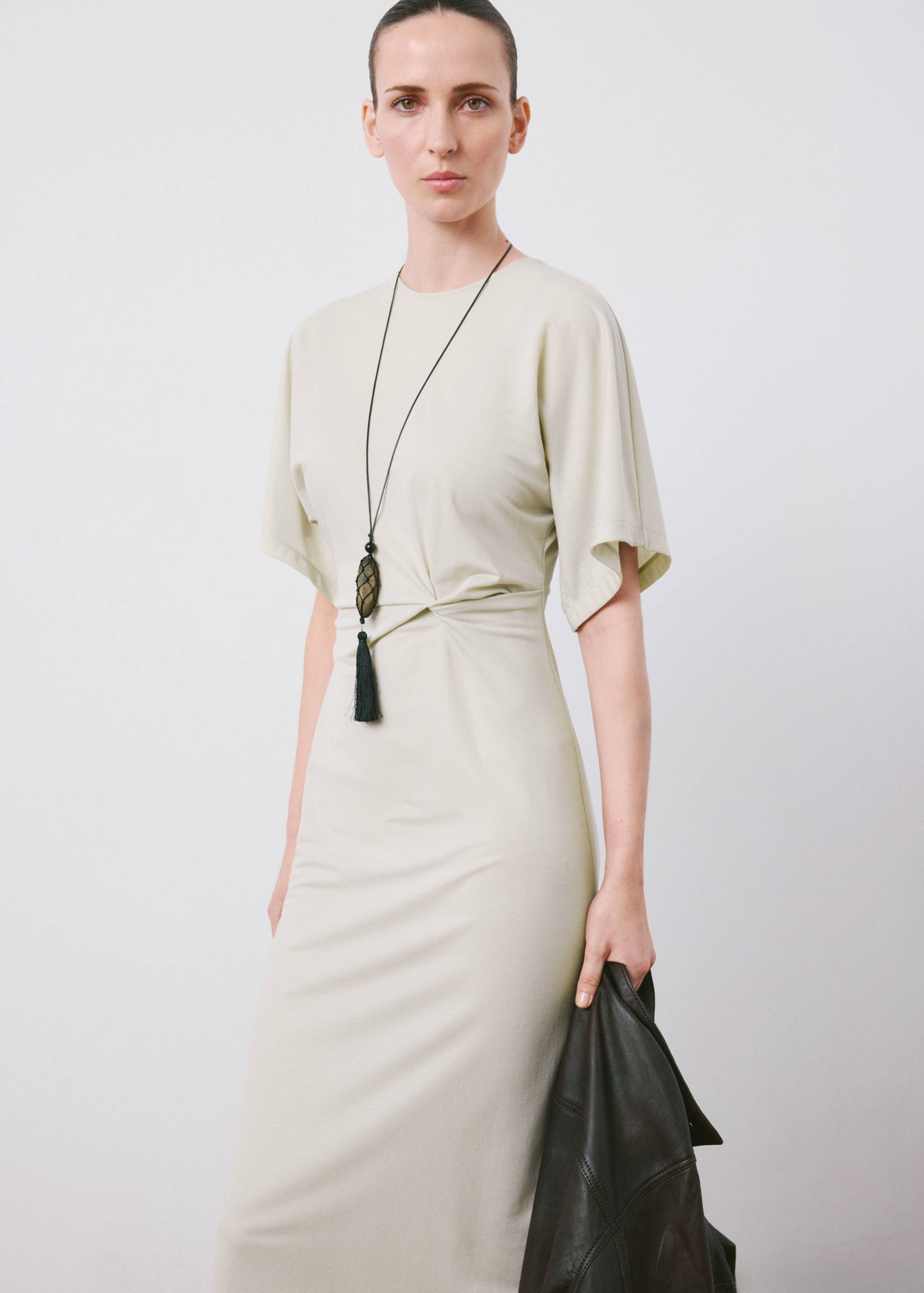 Light beige midi dress with short sleeves, round neck and waist knot detail.