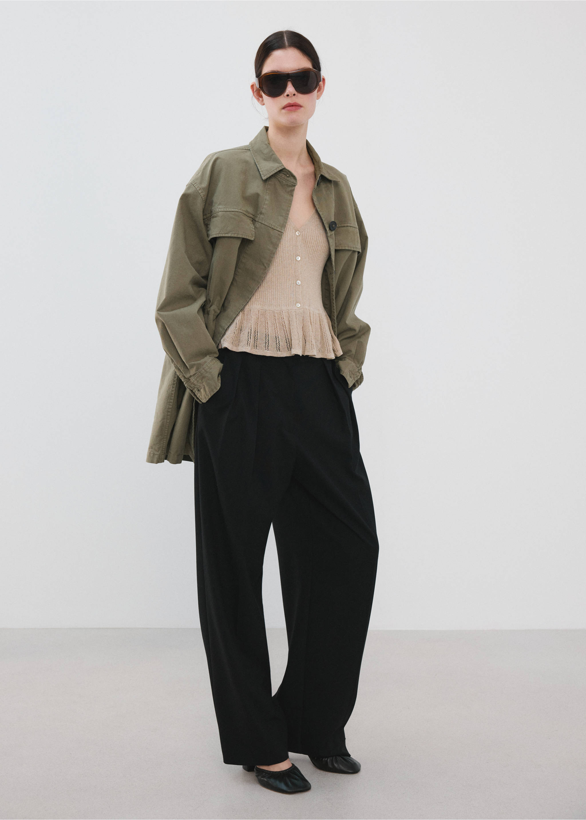 Beige knitted cardigan with button fastening and flared hem, styled in an outfit., Sand. Ref: 27055840-00.