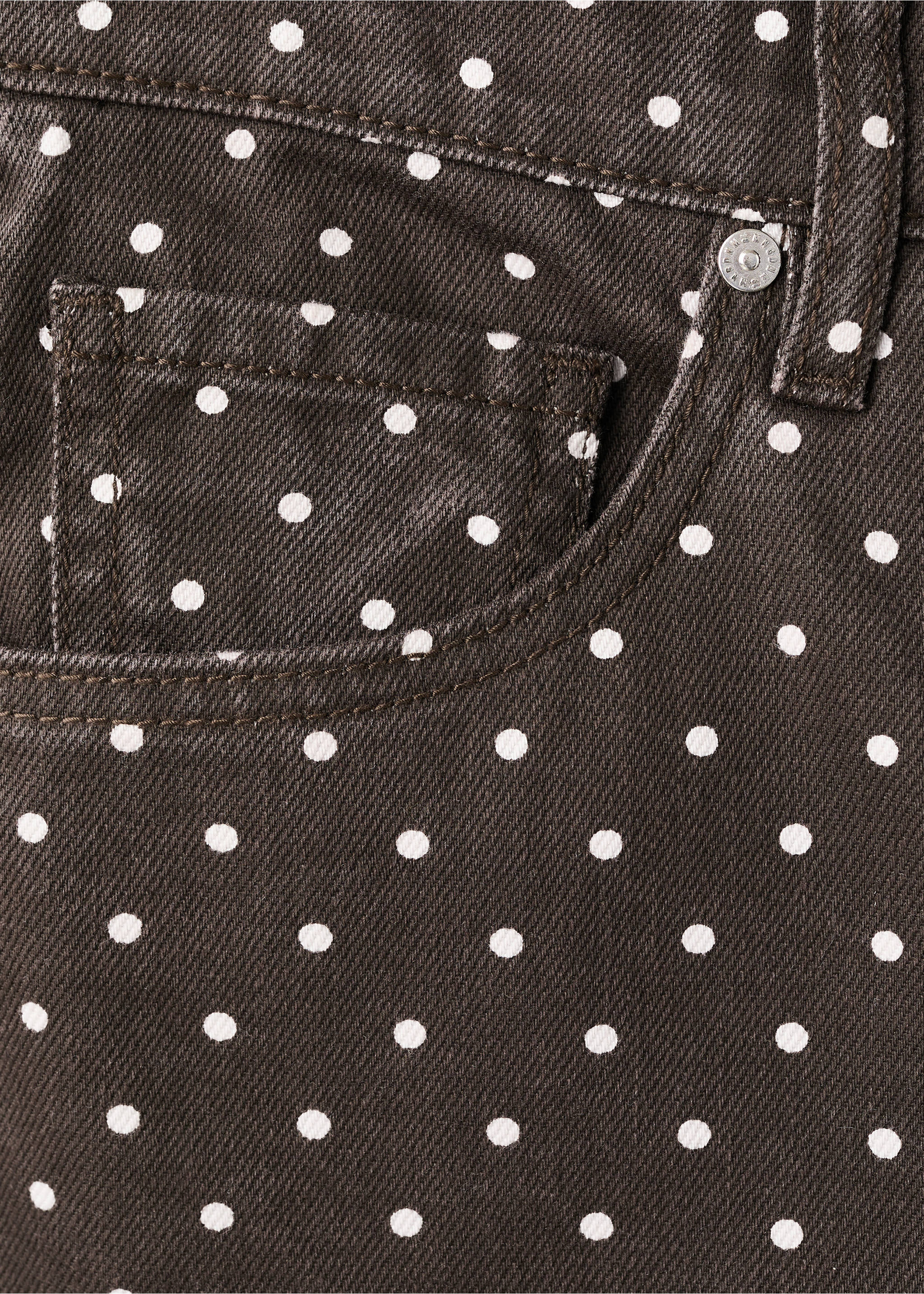Close-up of dark brown denim trousers with a white polka dot pattern., Chocolate. Ref: 27057159-00.