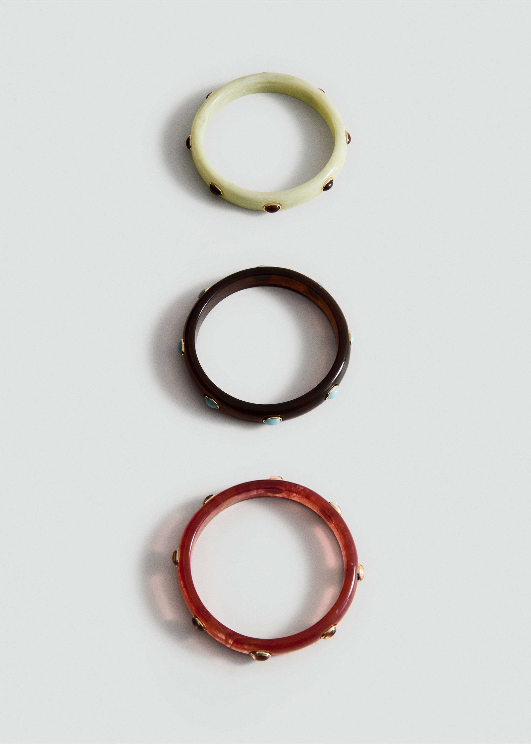 Set of three resin bangles in pale green, dark brown, and reddish-brown with stone accents., Brown. Ref: 27057790-00.